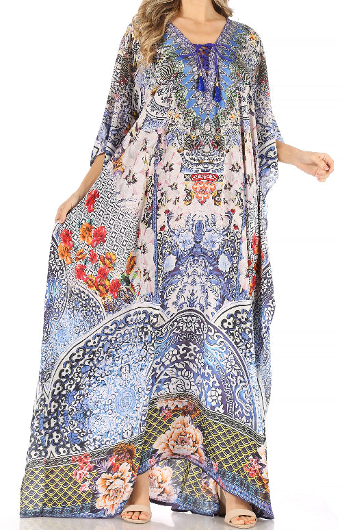 Woman wearing a colorful patterned dress with floral and abstract designs.