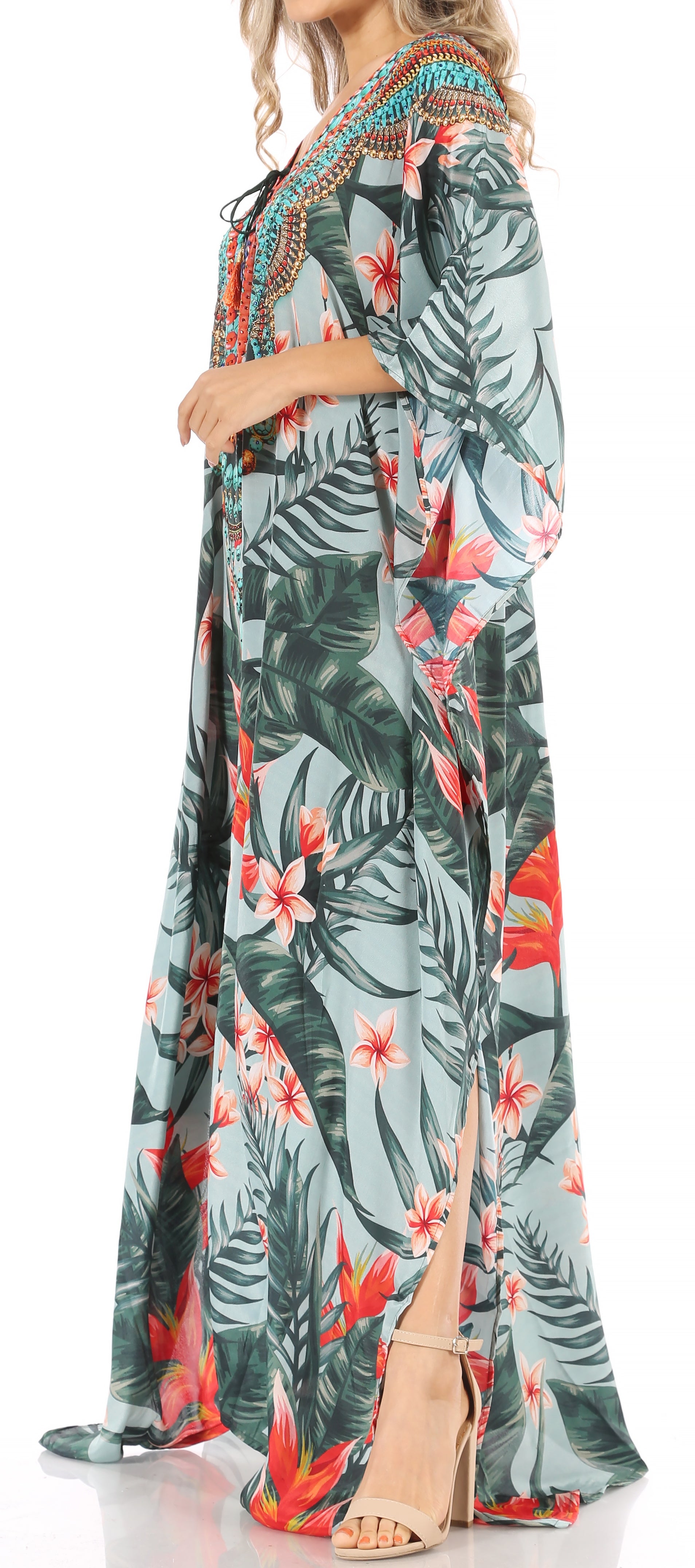 Long floral dress with a palm leaf pattern on a white background