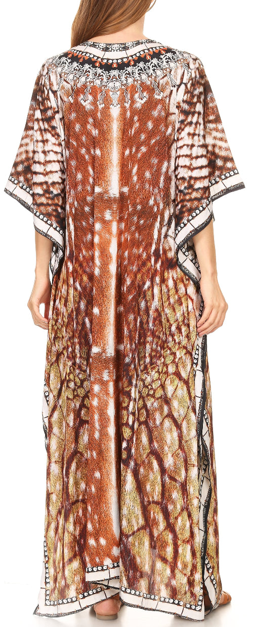 Woman wearing a long, patterned dress with a neutral background