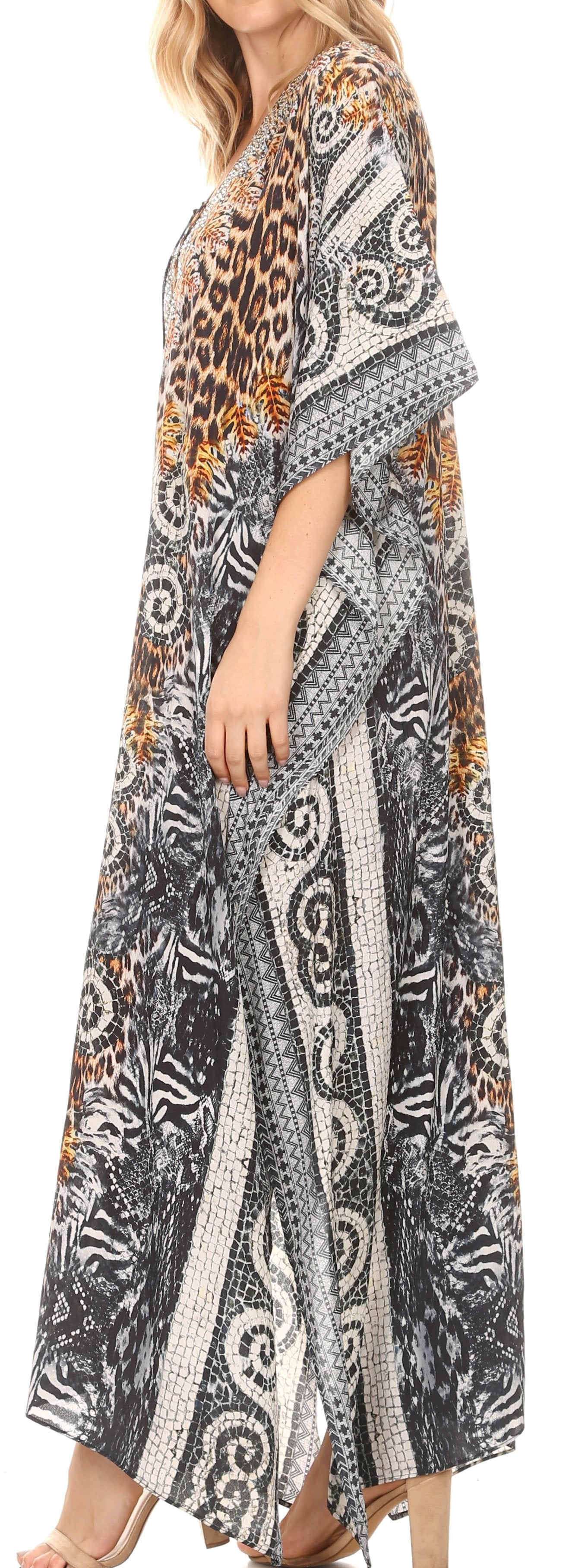 Woman wearing a long, patterned dress with a mix of animal and abstract designs.
