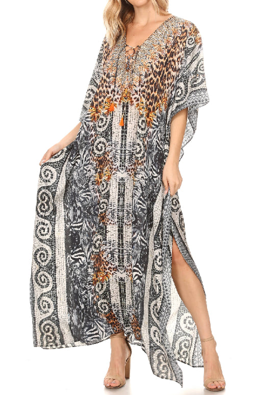 Woman wearing a long, patterned dress with a white background