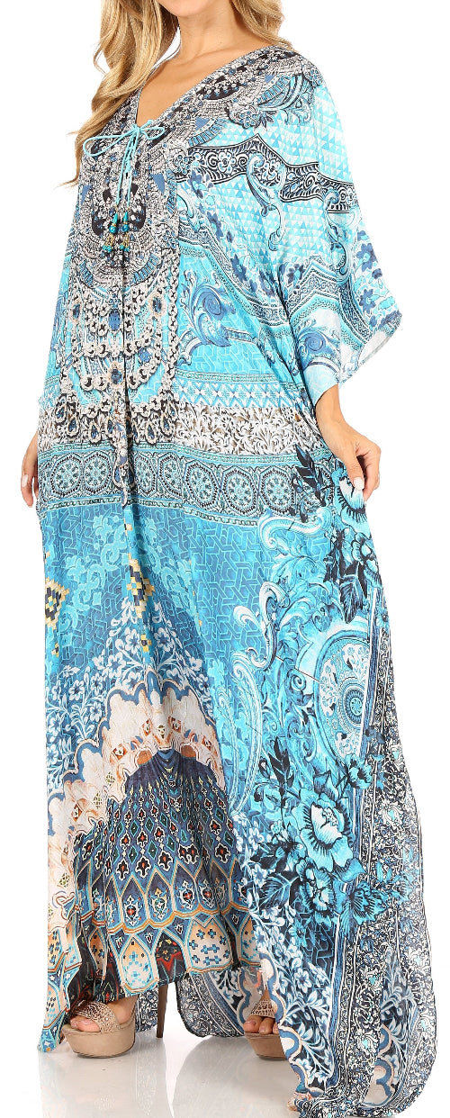 Woman wearing a long, patterned dress with a blue and gray design.