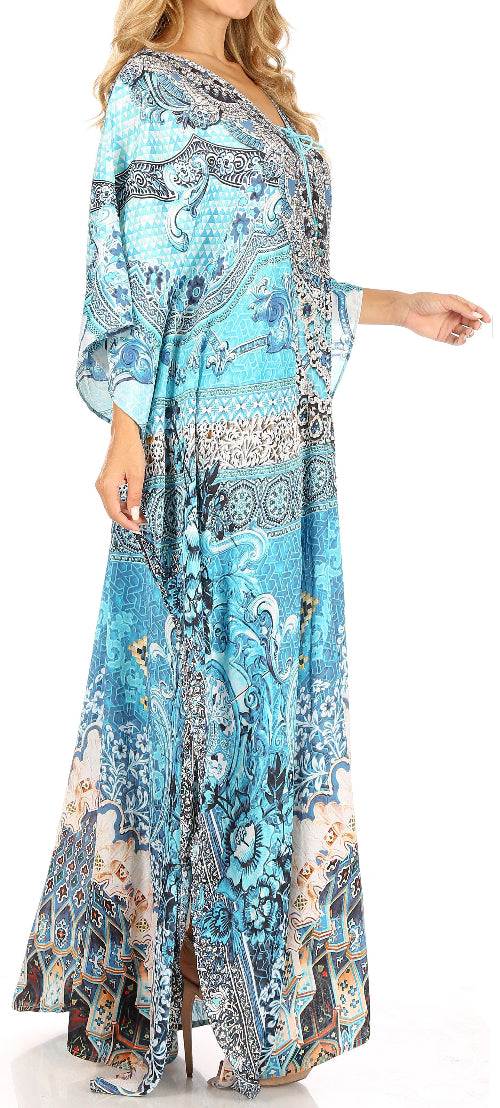Woman wearing a long, patterned dress with a blue and white design.