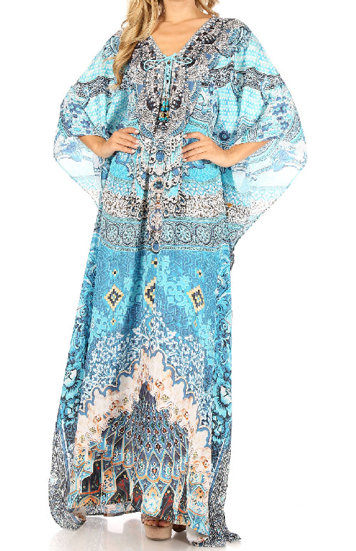 Woman wearing a blue patterned kaftan dress on a white background