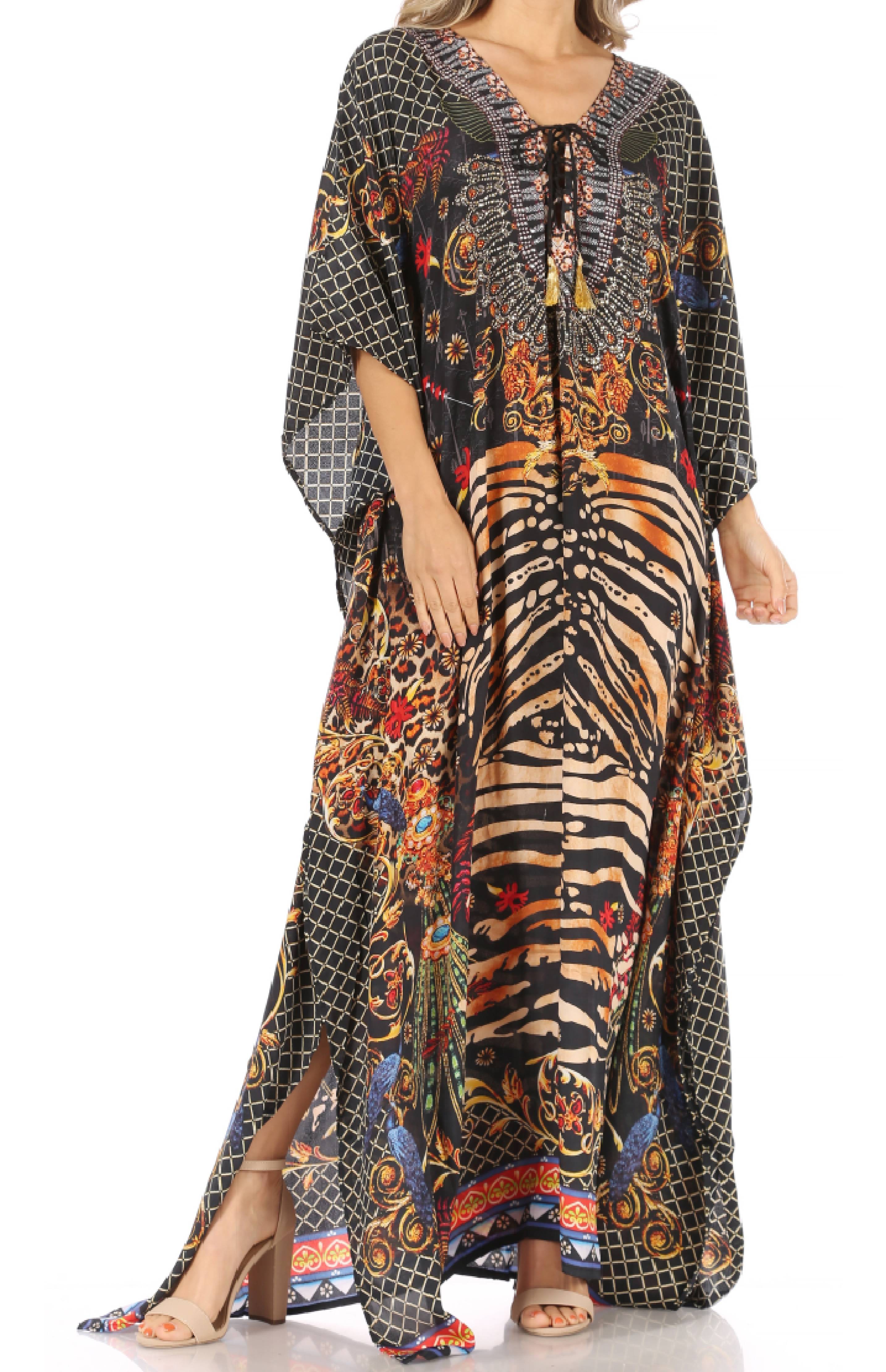 Woman wearing a long, patterned dress with a mix of zebra and abstract designs on a white background.