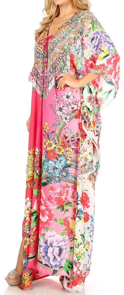 Woman wearing a colorful floral dress with a white background