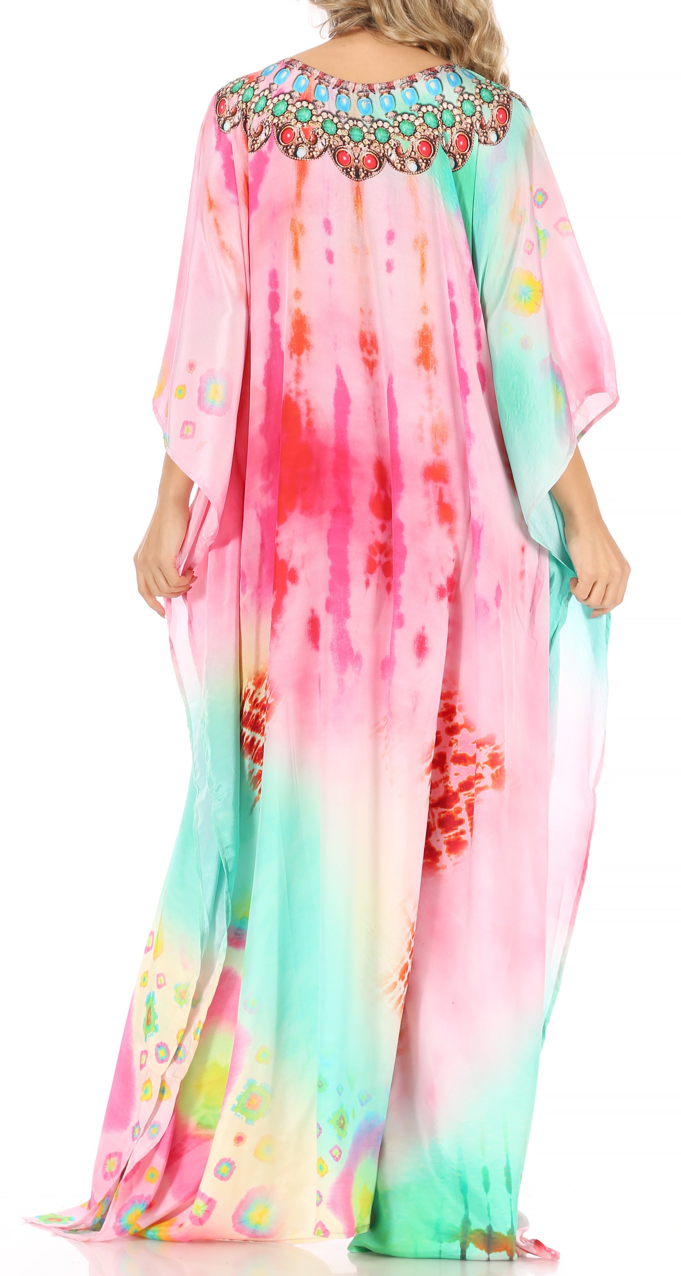 Colorful tie-dye dress with floral embellishments on a white background
