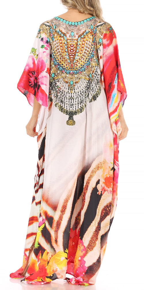 Colorful dress with floral and abstract patterns and beaded embellishments.