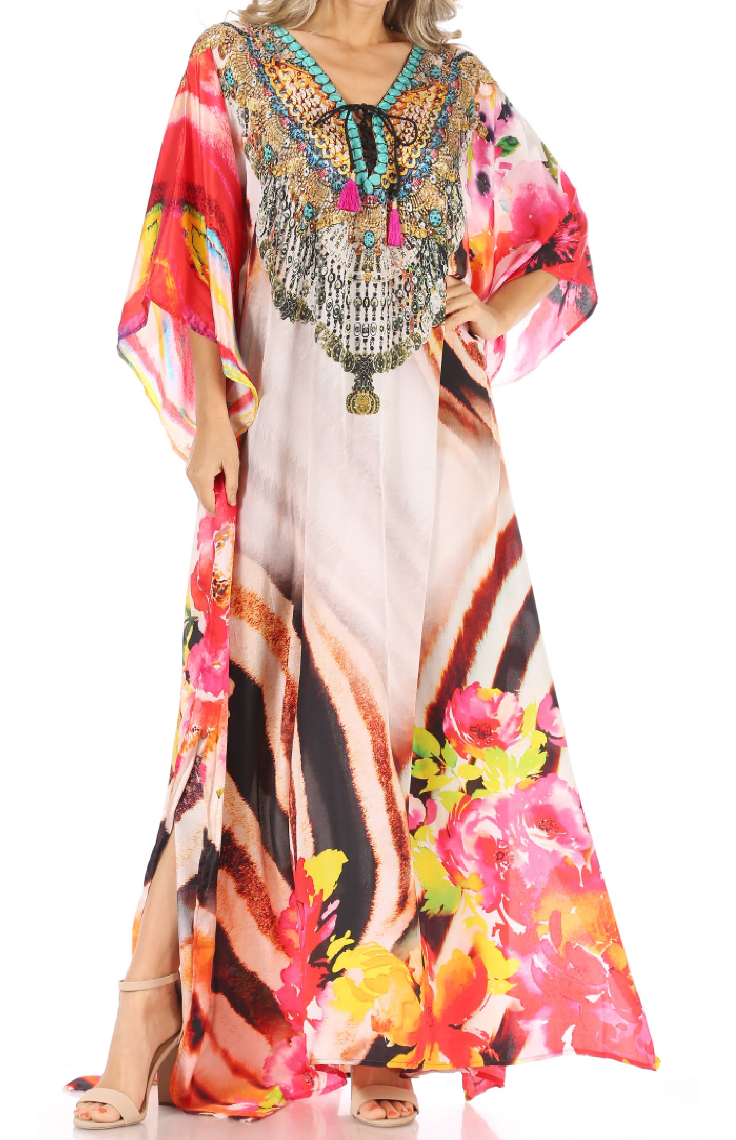 Colorful floral and abstract patterned dress with embellishments on a white background