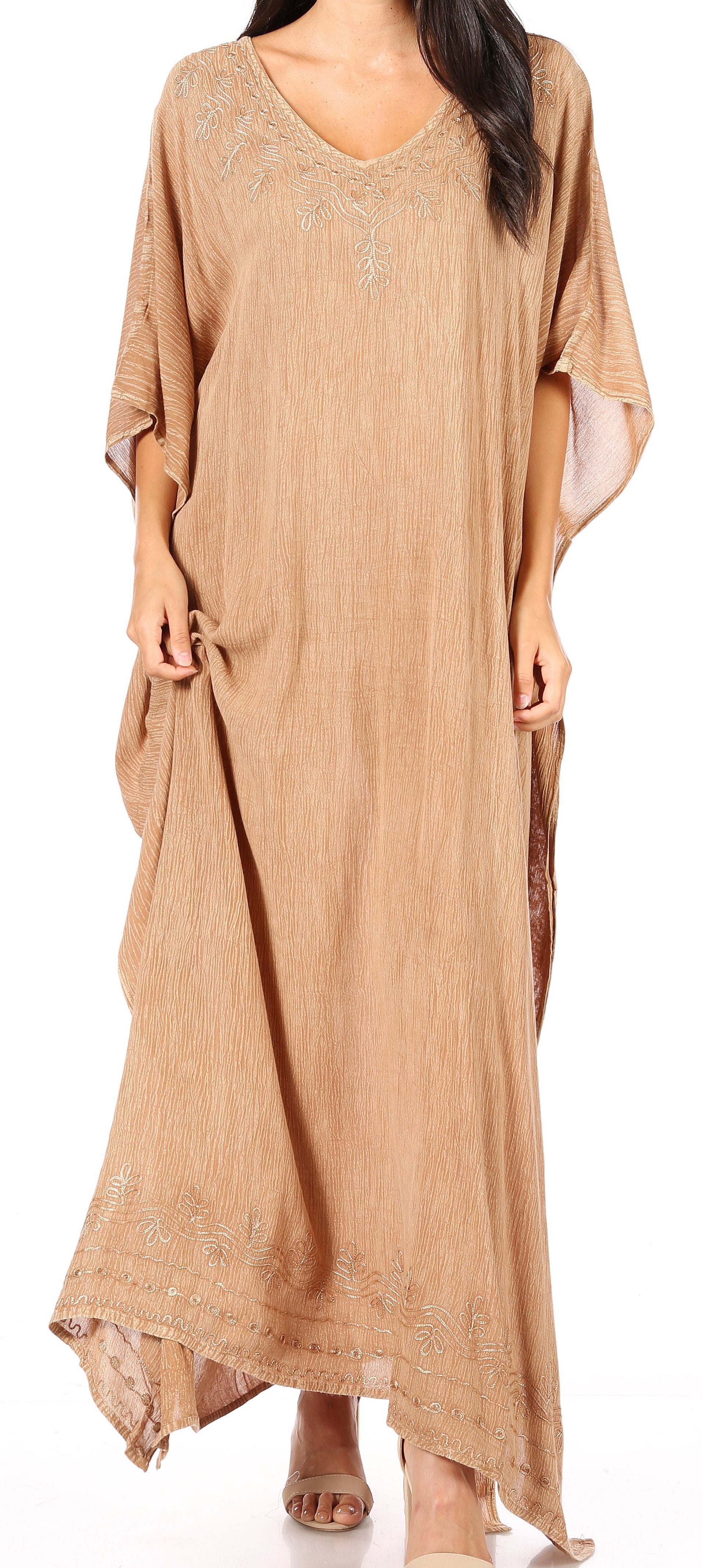 Beige long dress with a subtle pattern on a white background