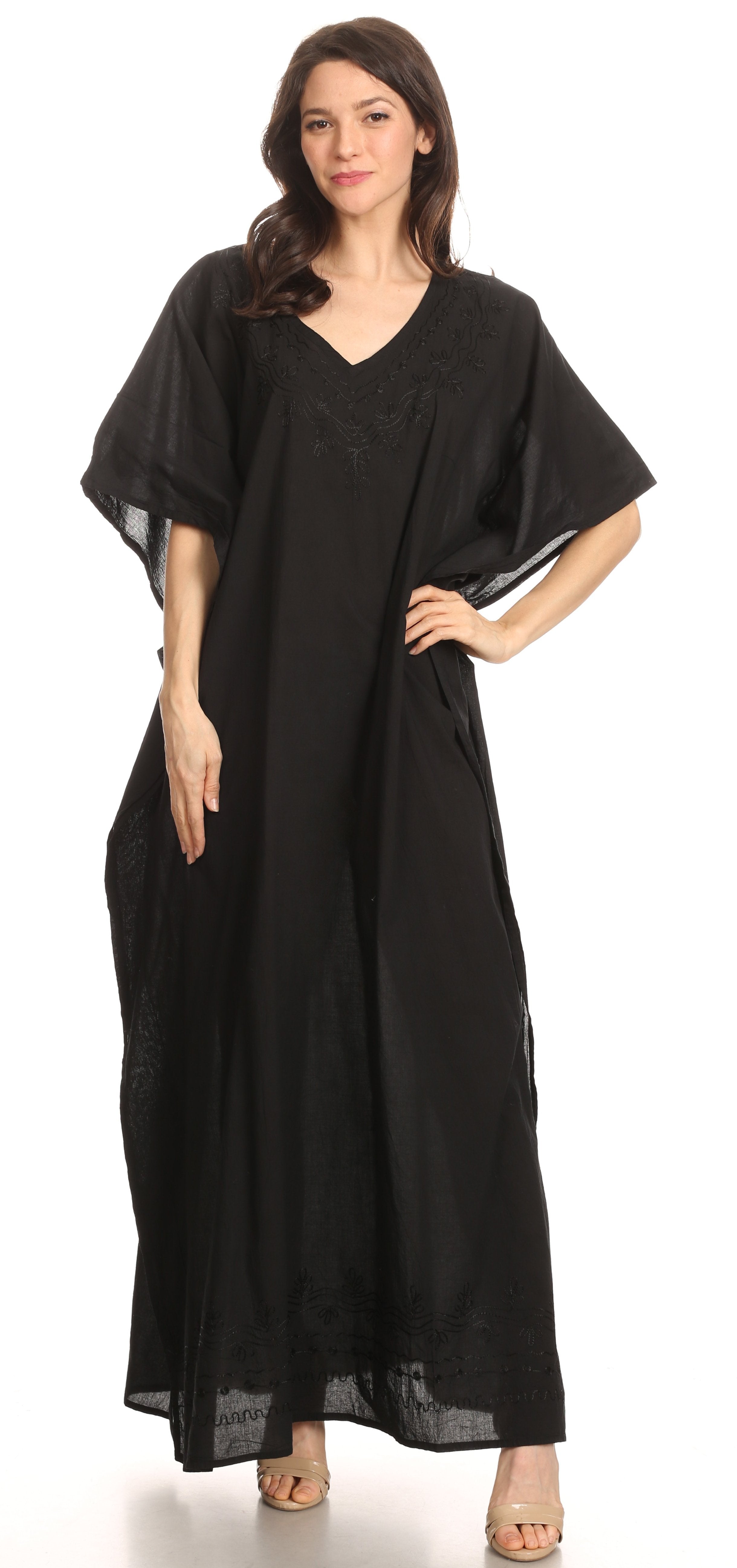 Woman wearing a black caftan on a white background