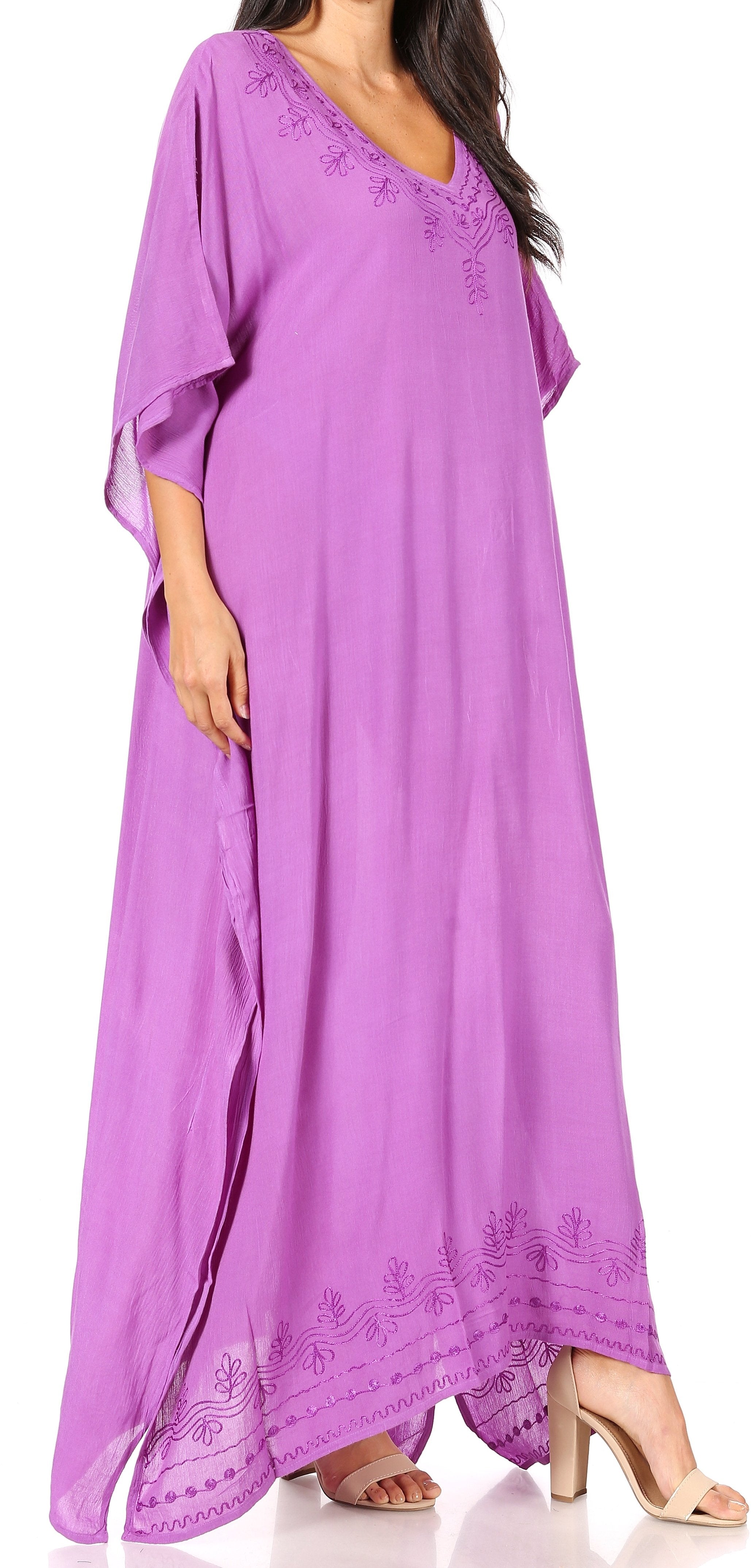 Woman wearing a purple maxi dress with lace details on a white background