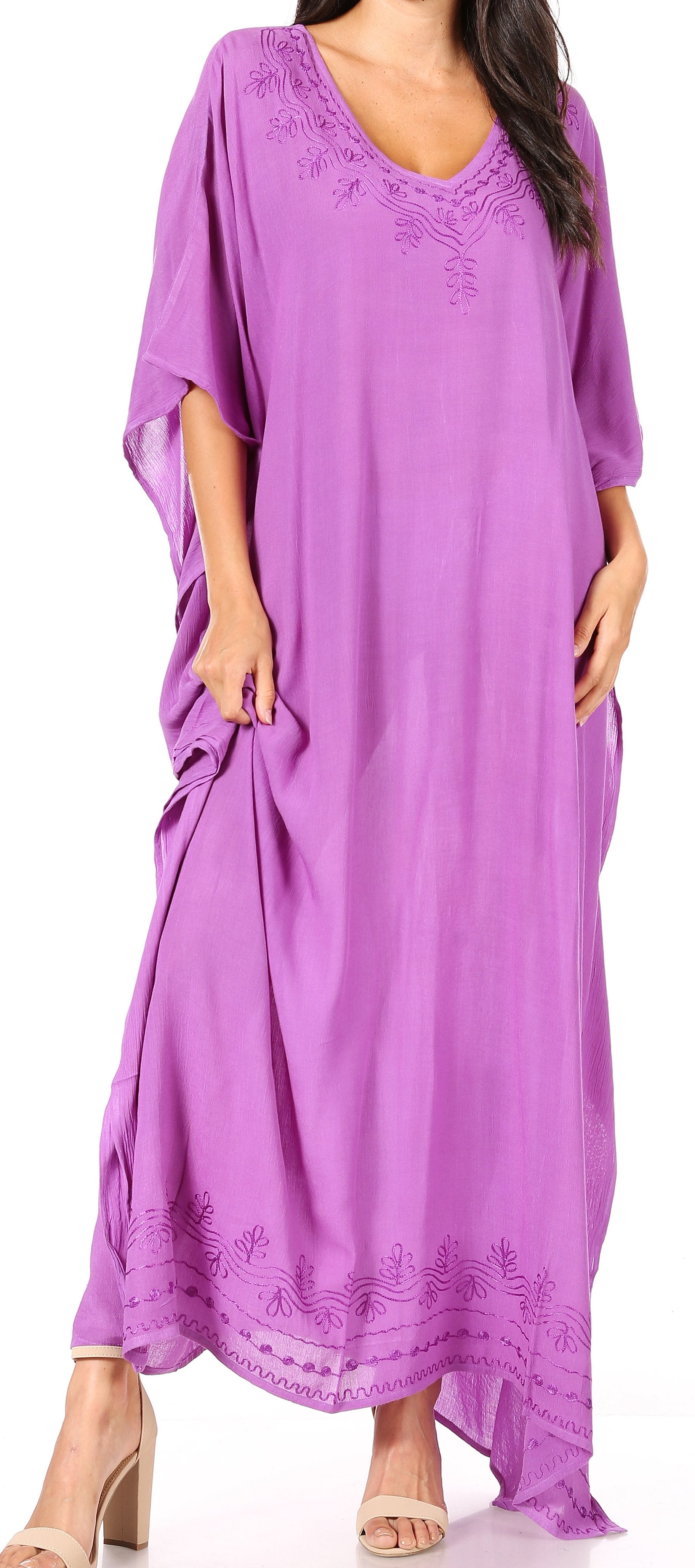 Purple caftan with lace details on a plain background