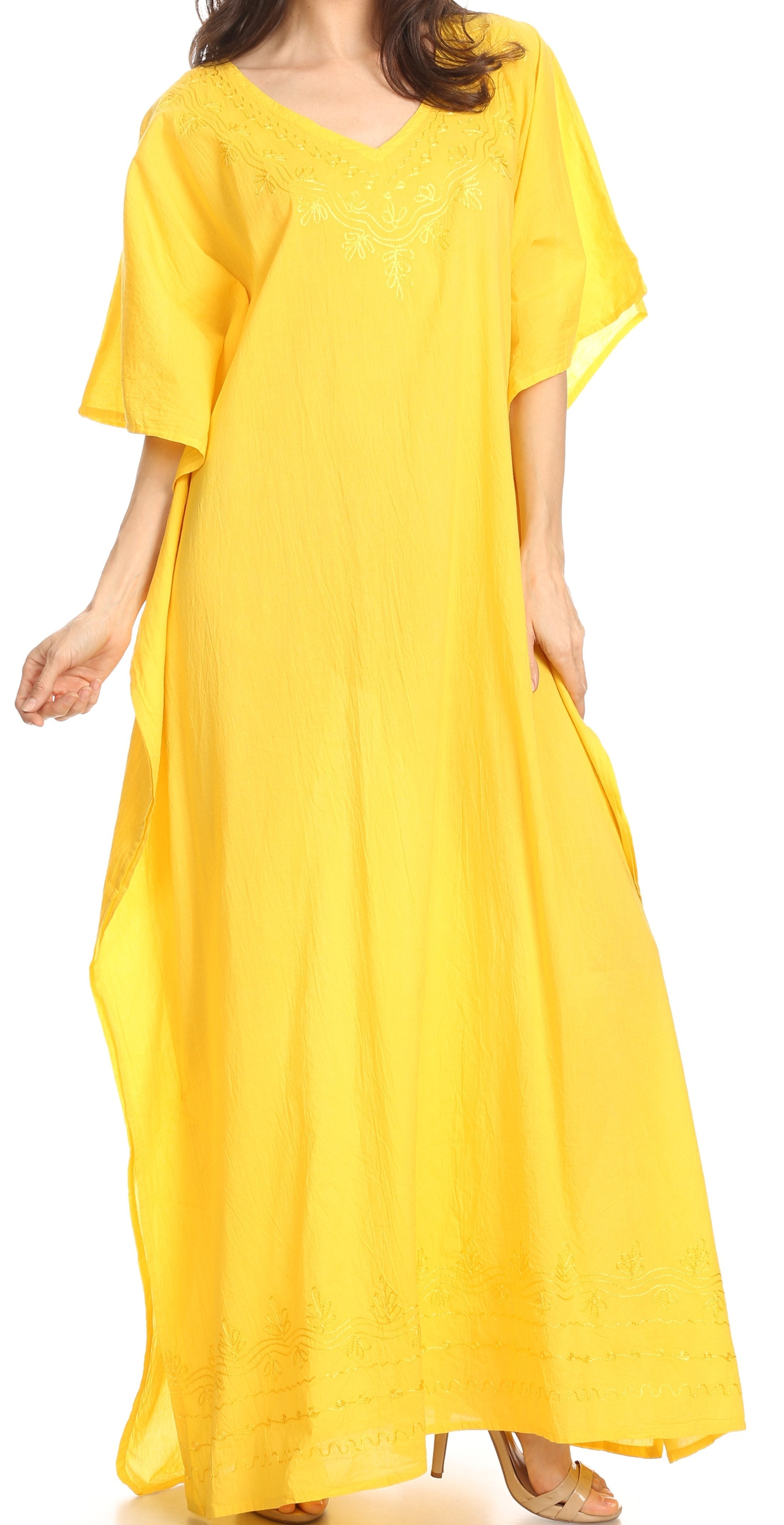 Woman wearing a yellow dress on a white background