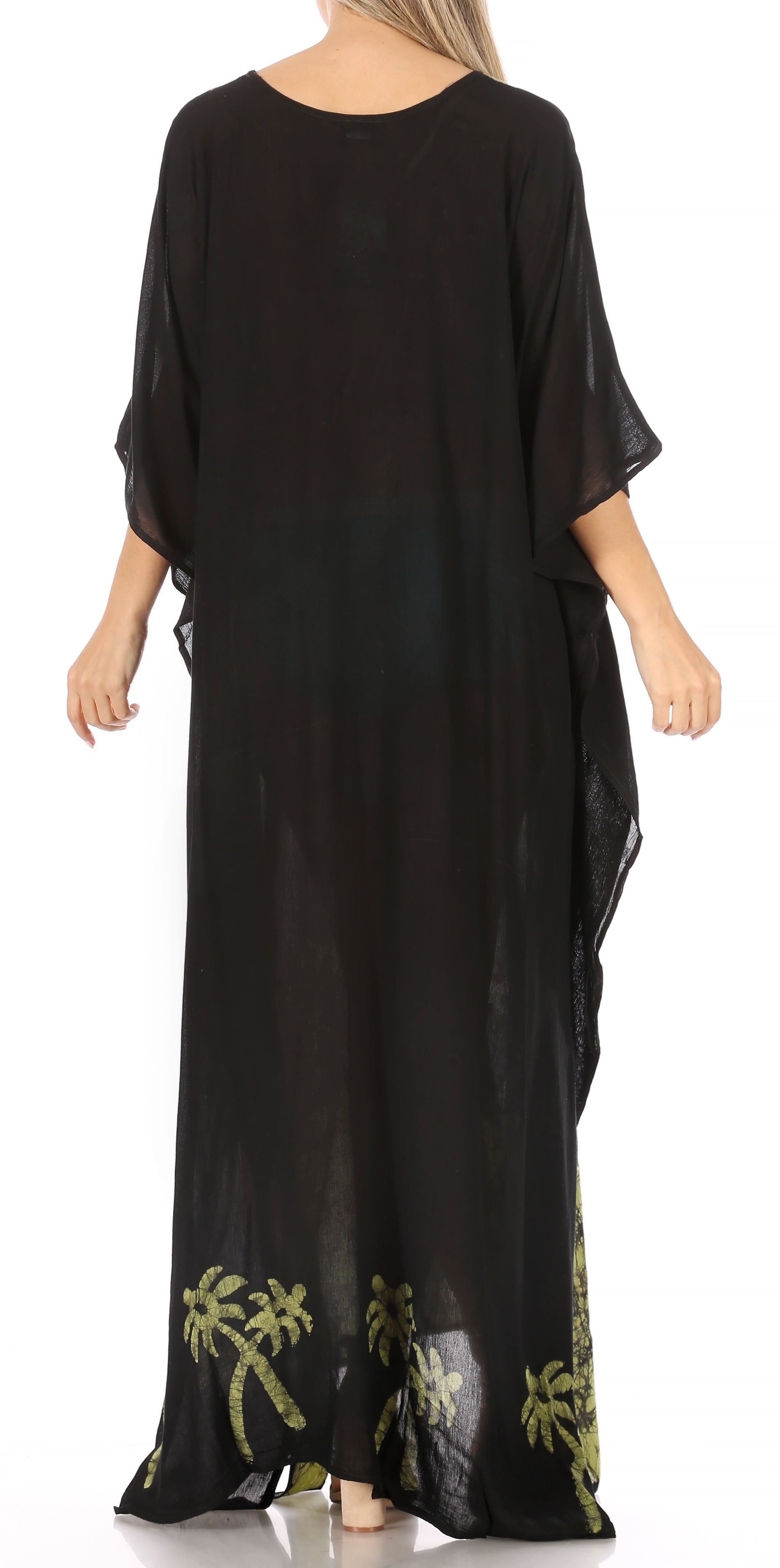 Black dress with green palm tree designs on a white background