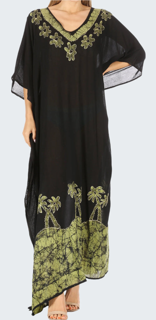 Black dress with green floral embroidery on a white background