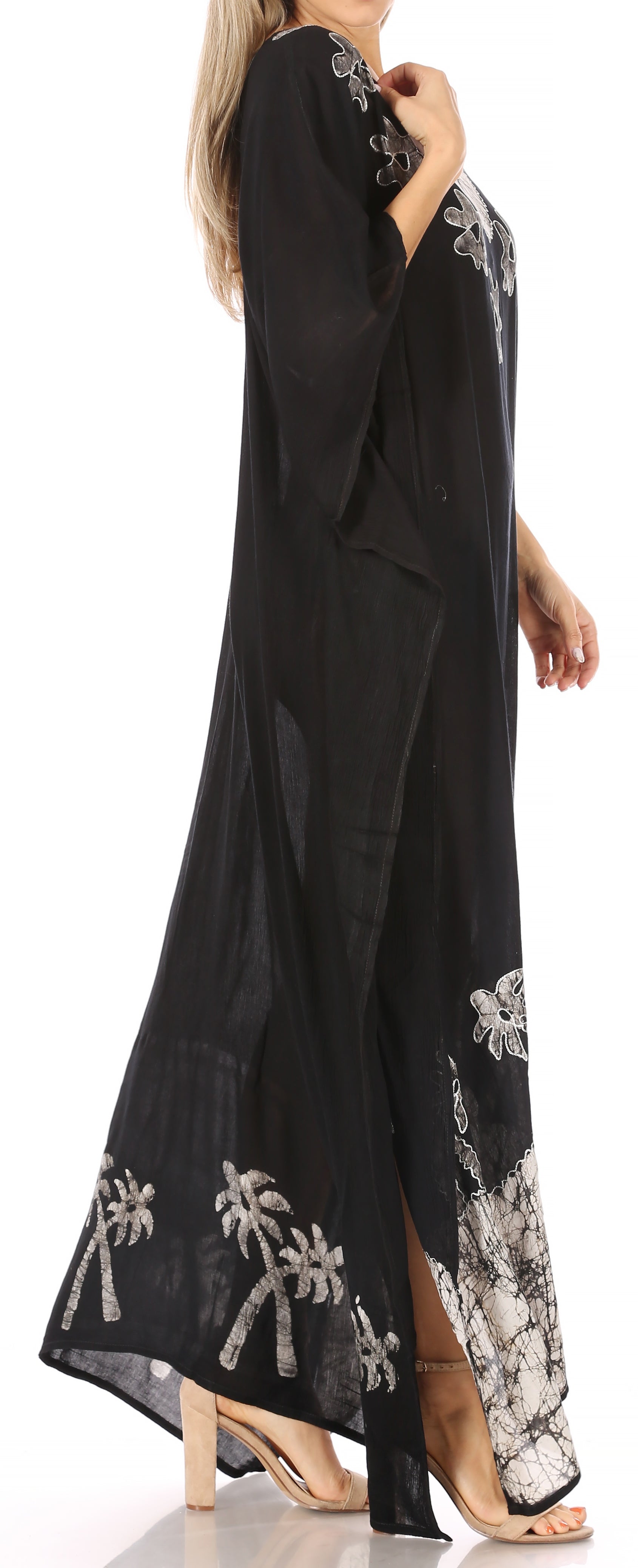 Black dress with white floral embroidery on a white background