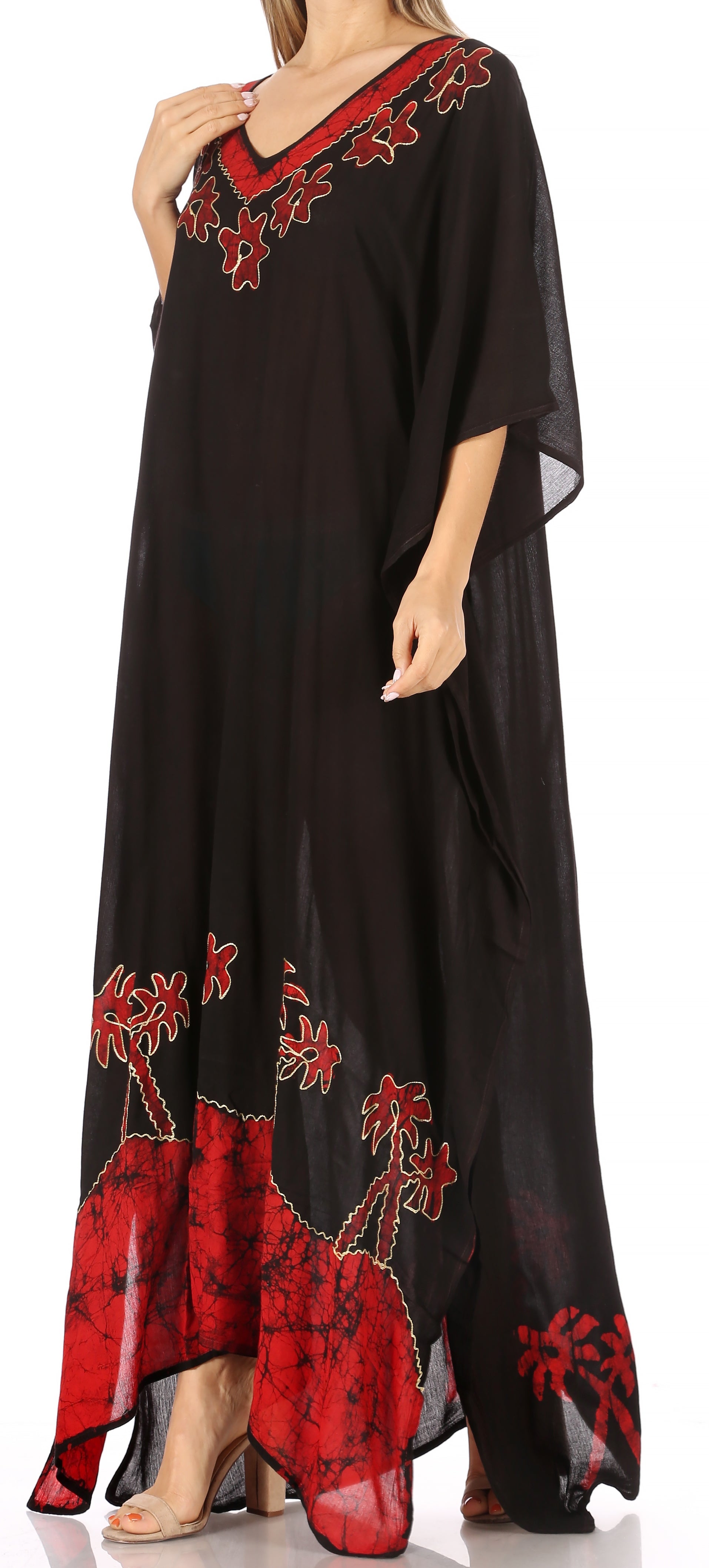 Black dress with red floral embroidery on a white background