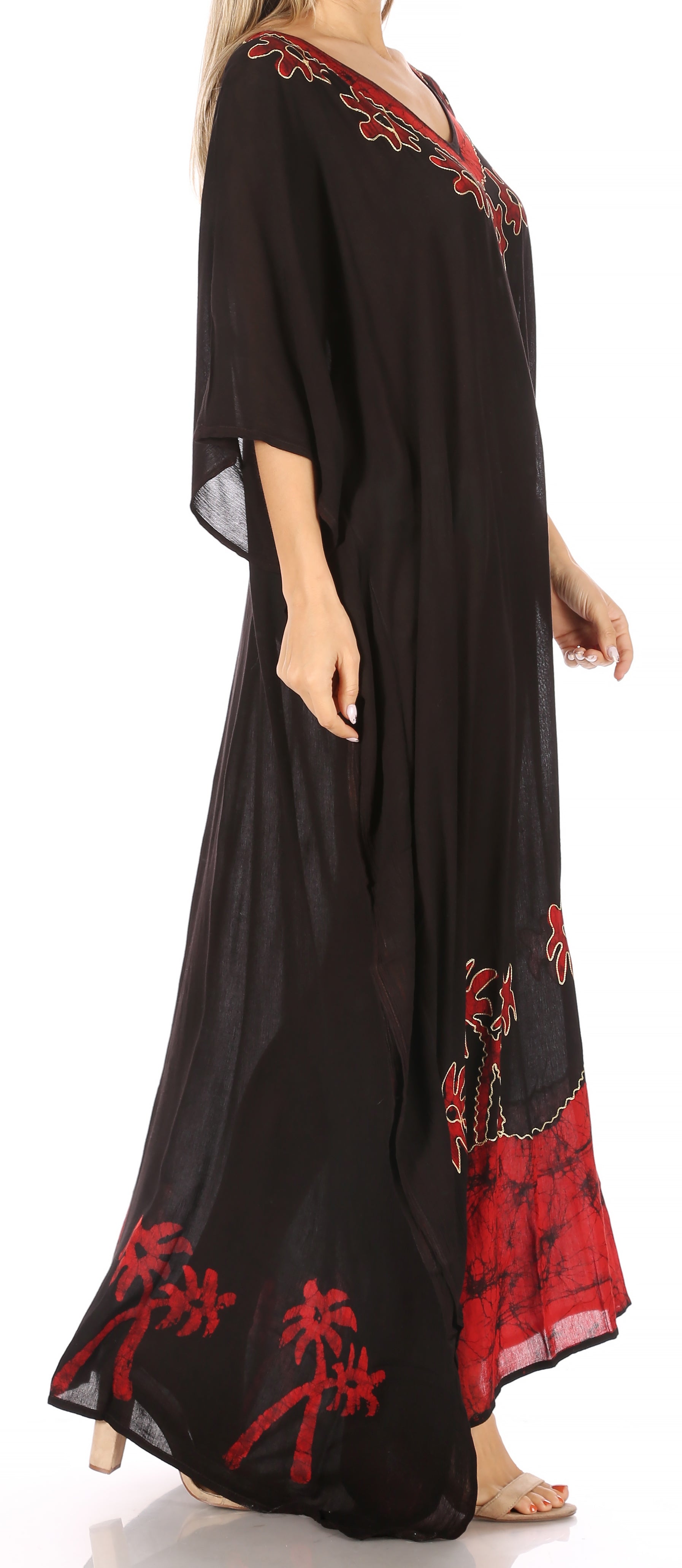 Black dress with red floral embroidery on a white background
