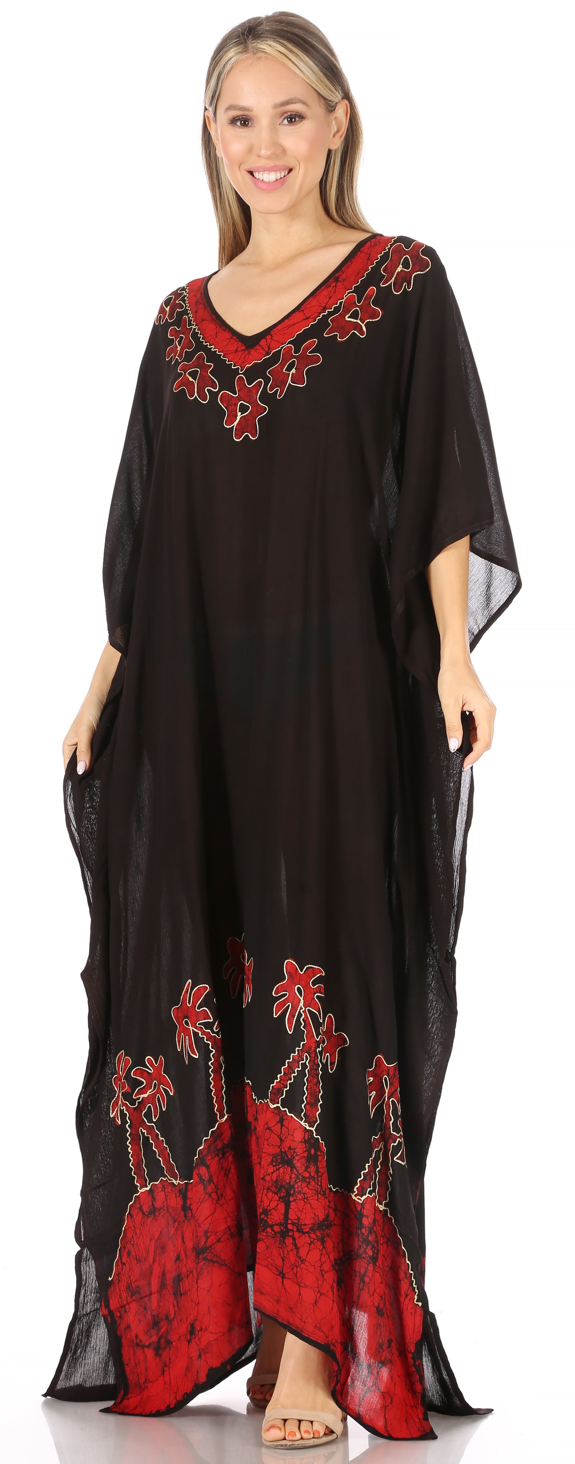 Woman wearing a black caftan with red embroidery