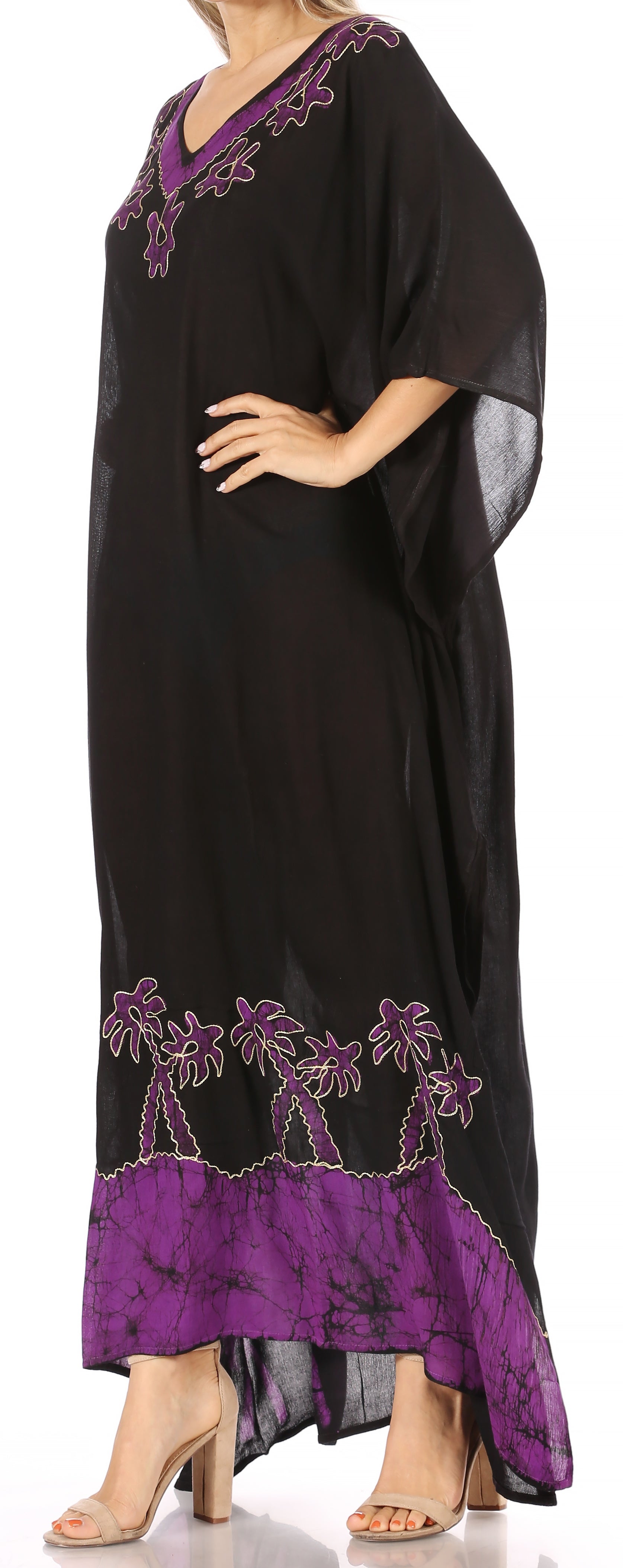 Black and purple dress with palm tree design on a white background