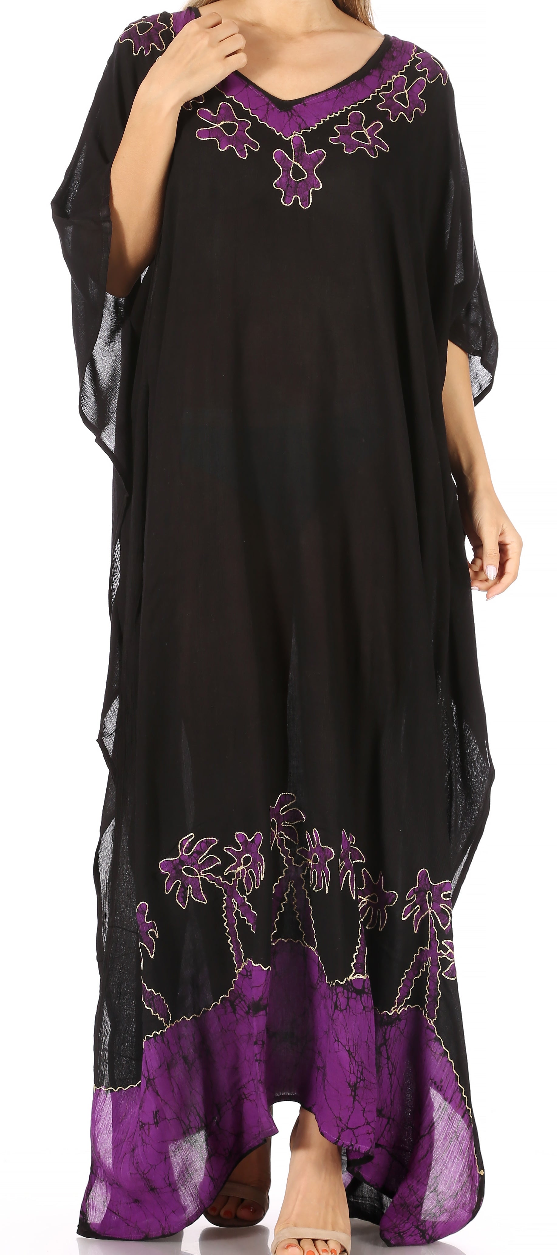 Black and purple dress with floral embroidery on a white background