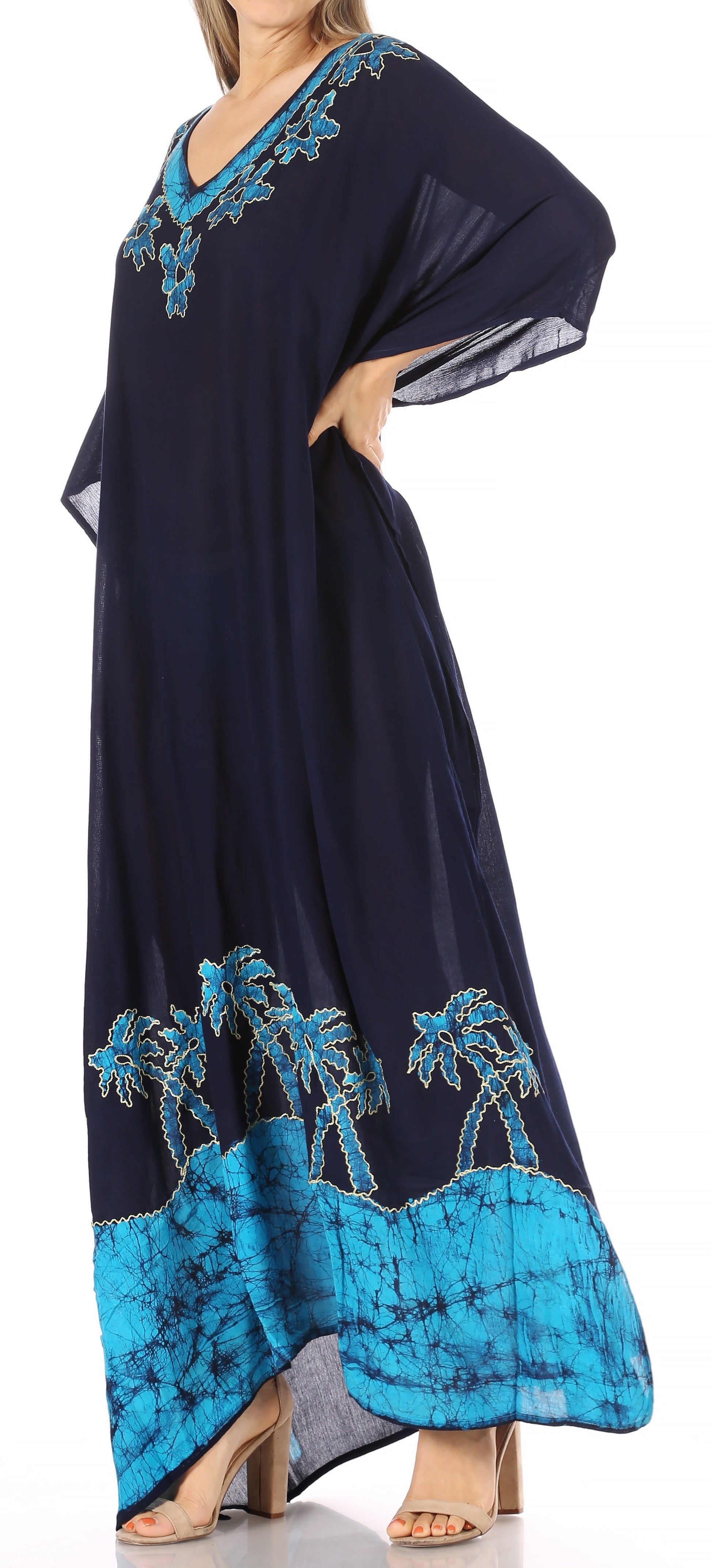 Navy blue dress with turquoise palm tree design on a white background