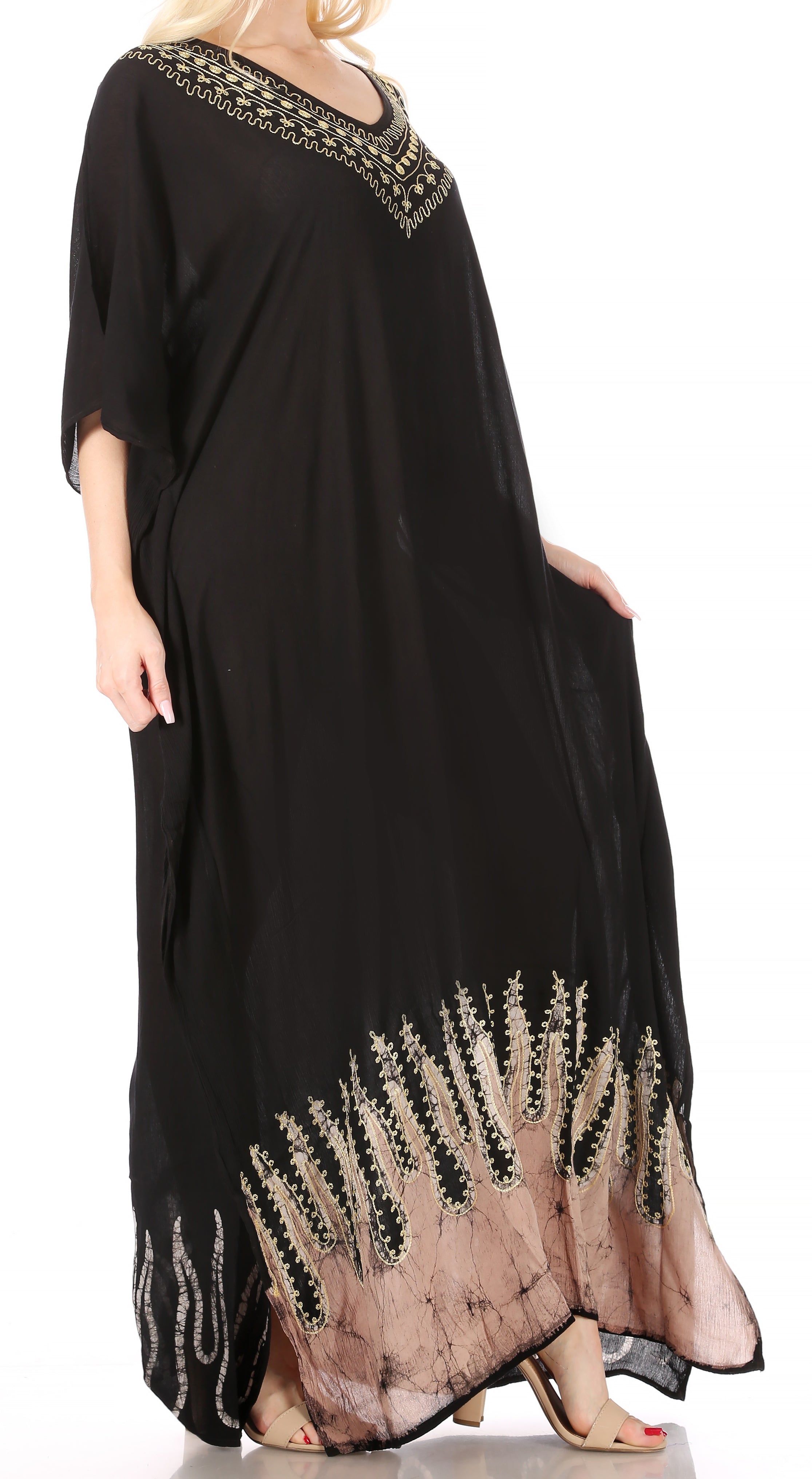 Black dress with gold embroidery on a white background