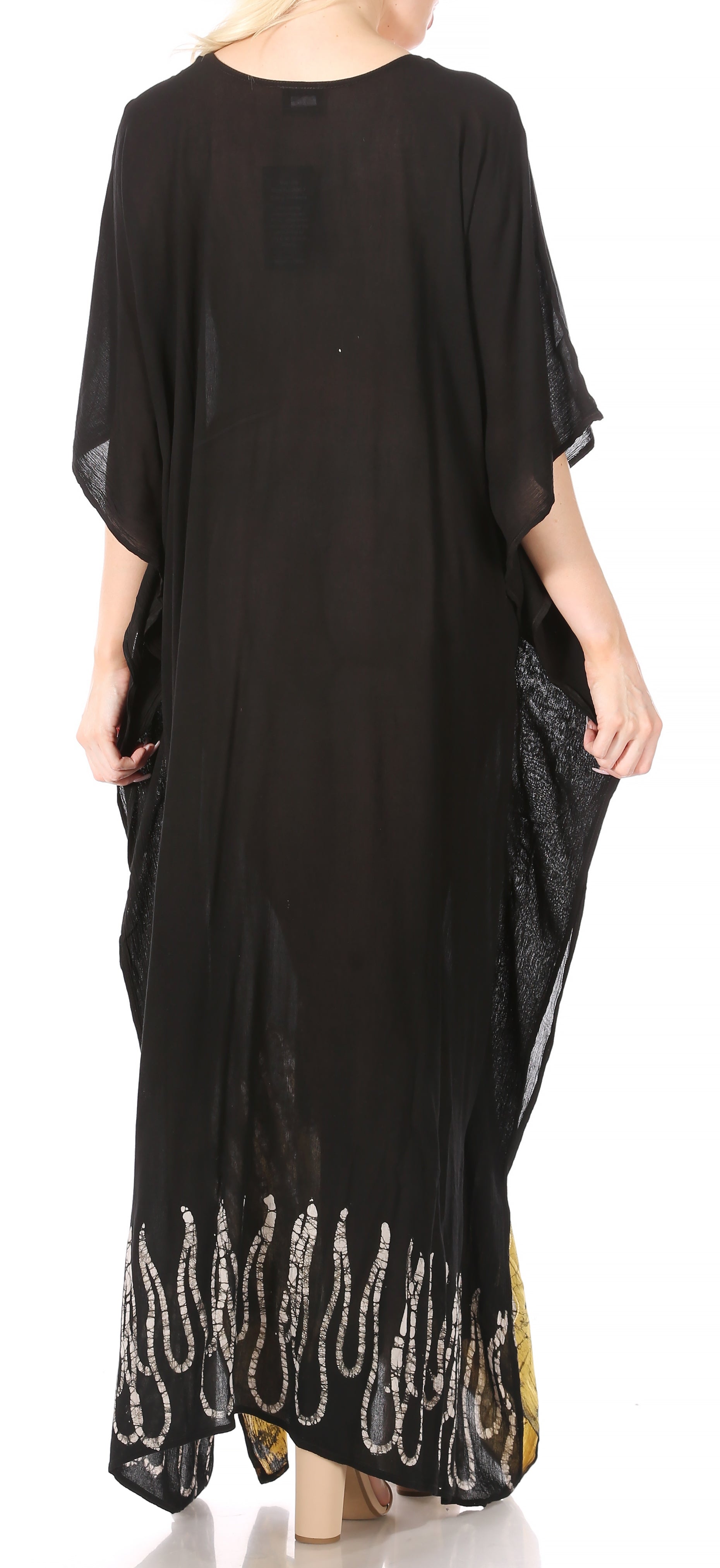 Black dress with sheer sleeves and embellished hem on a white background