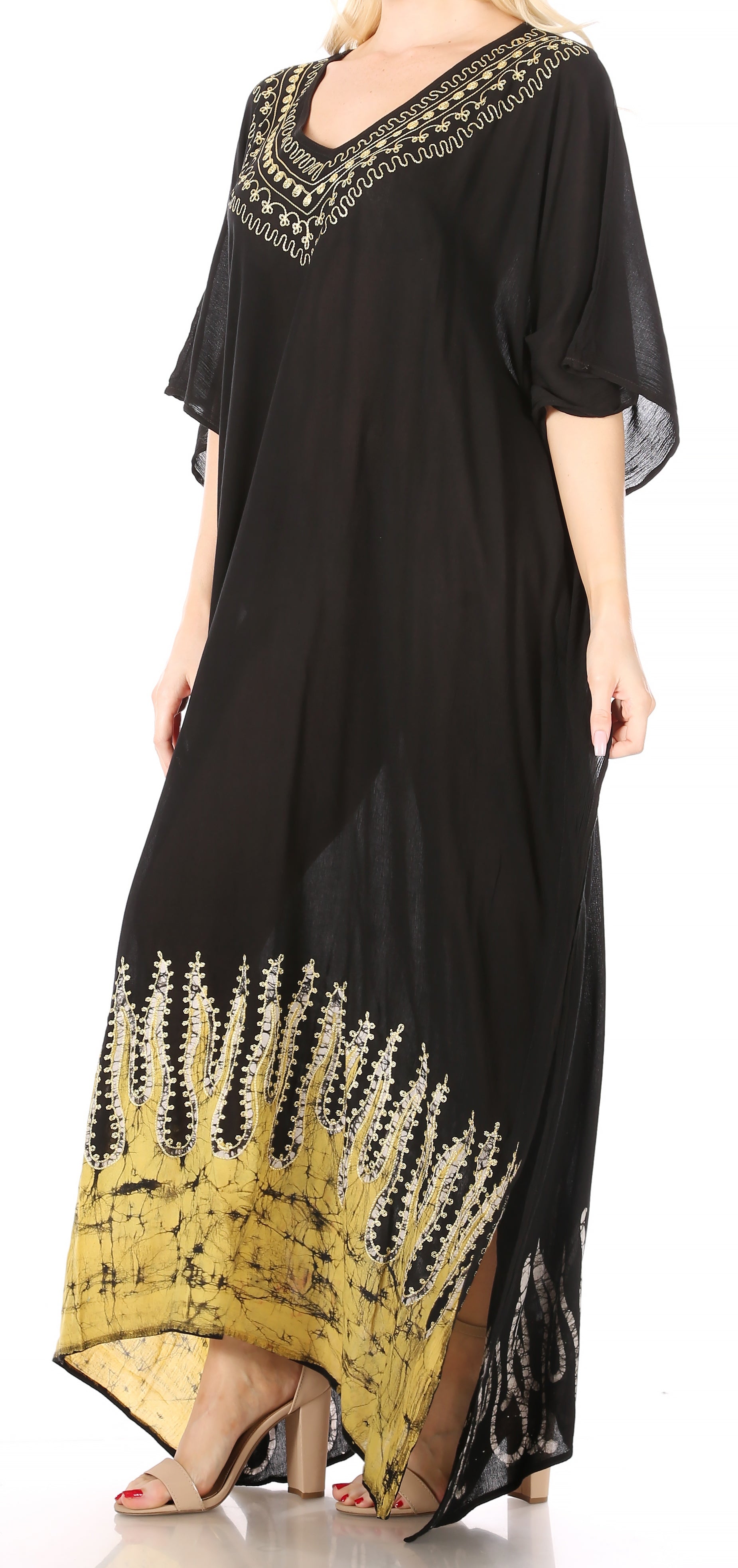 Black dress with yellow patterns and embroidery on a white background