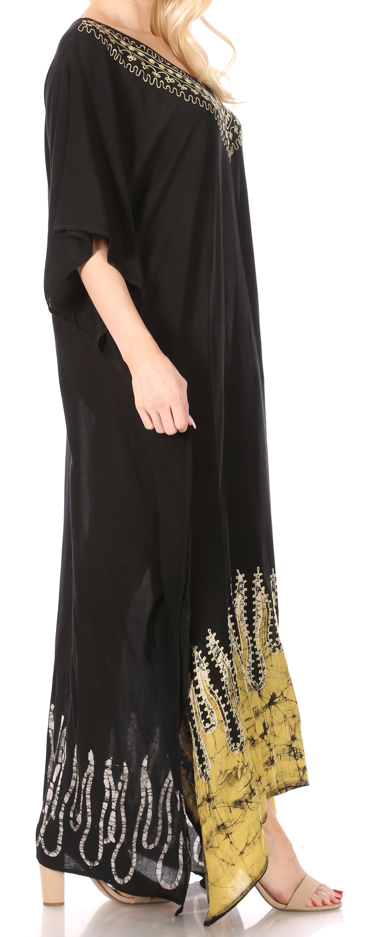 Black dress with gold embroidery on a white background