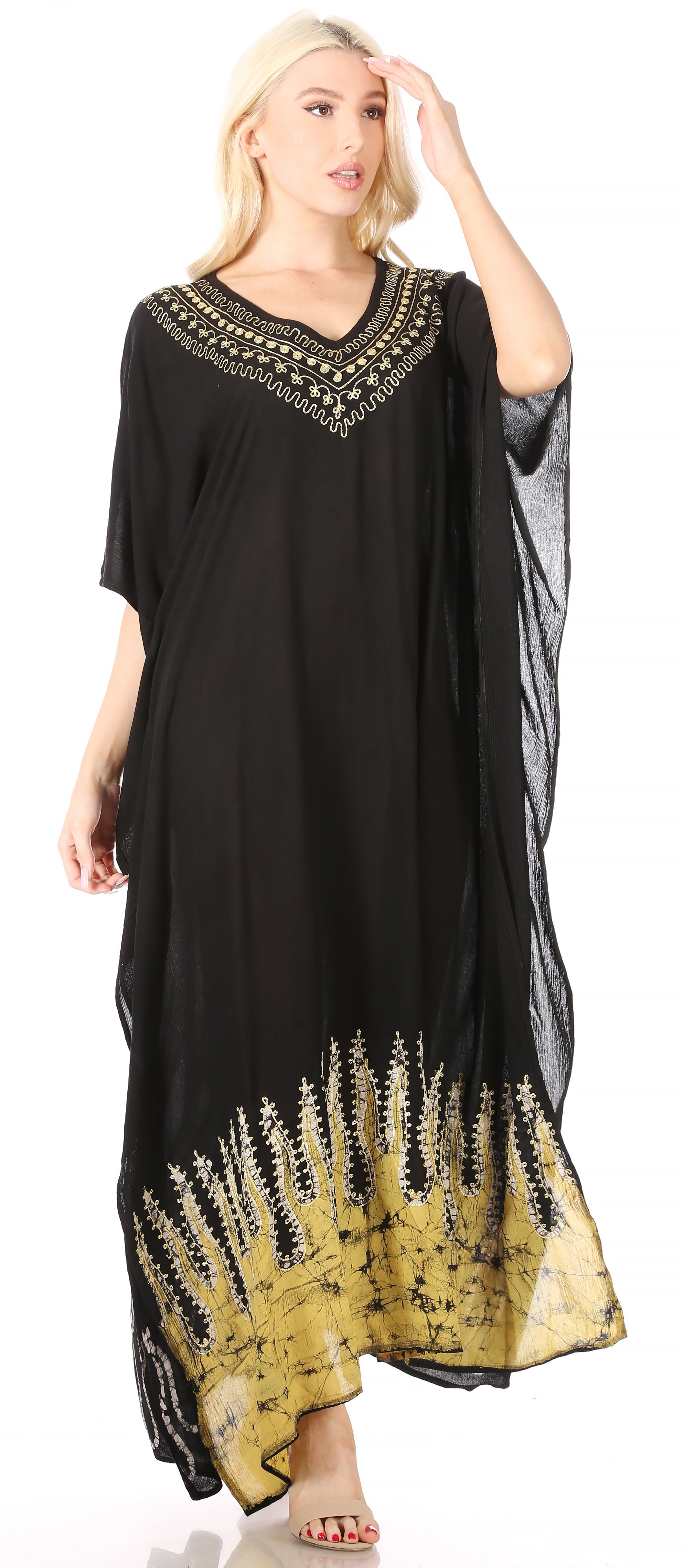 Black dress with gold embroidery on a white background