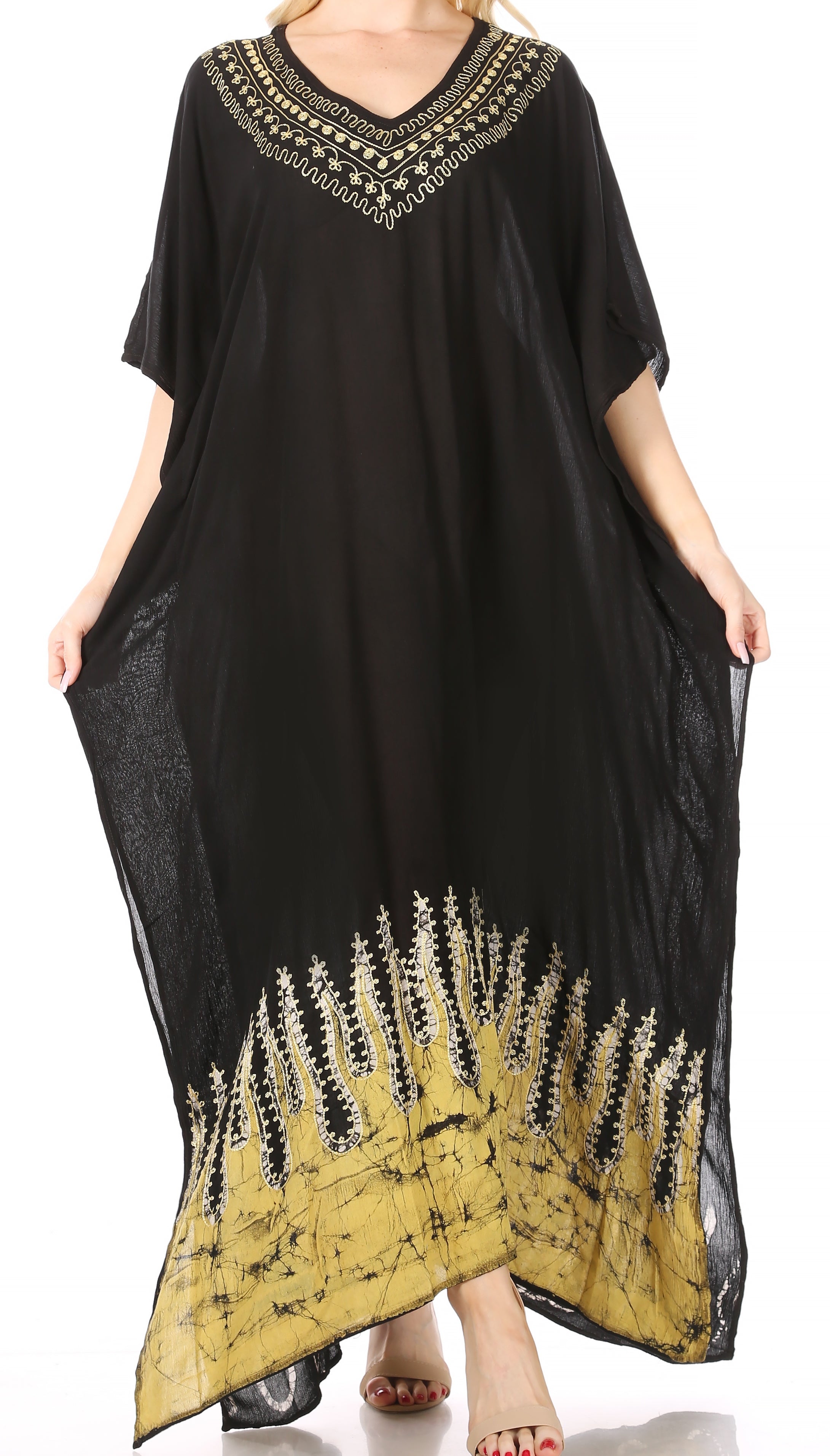 Black caftan with yellow and white patterned trim on a white background