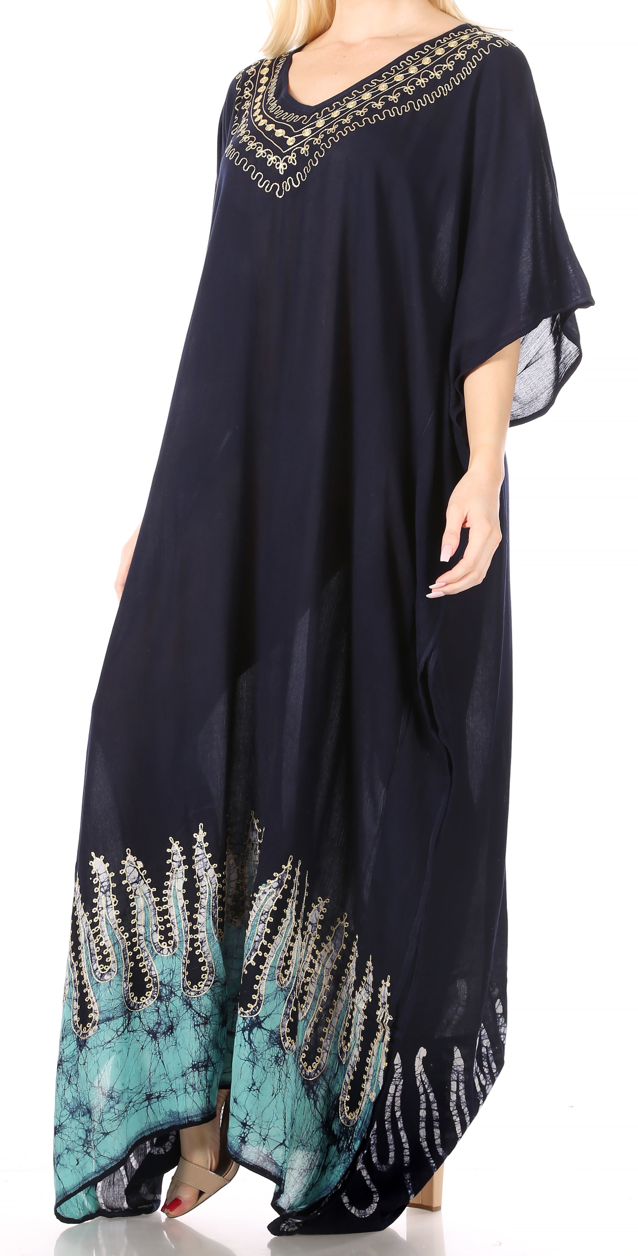 Navy blue dress with decorative patterns and embellishments on a white background