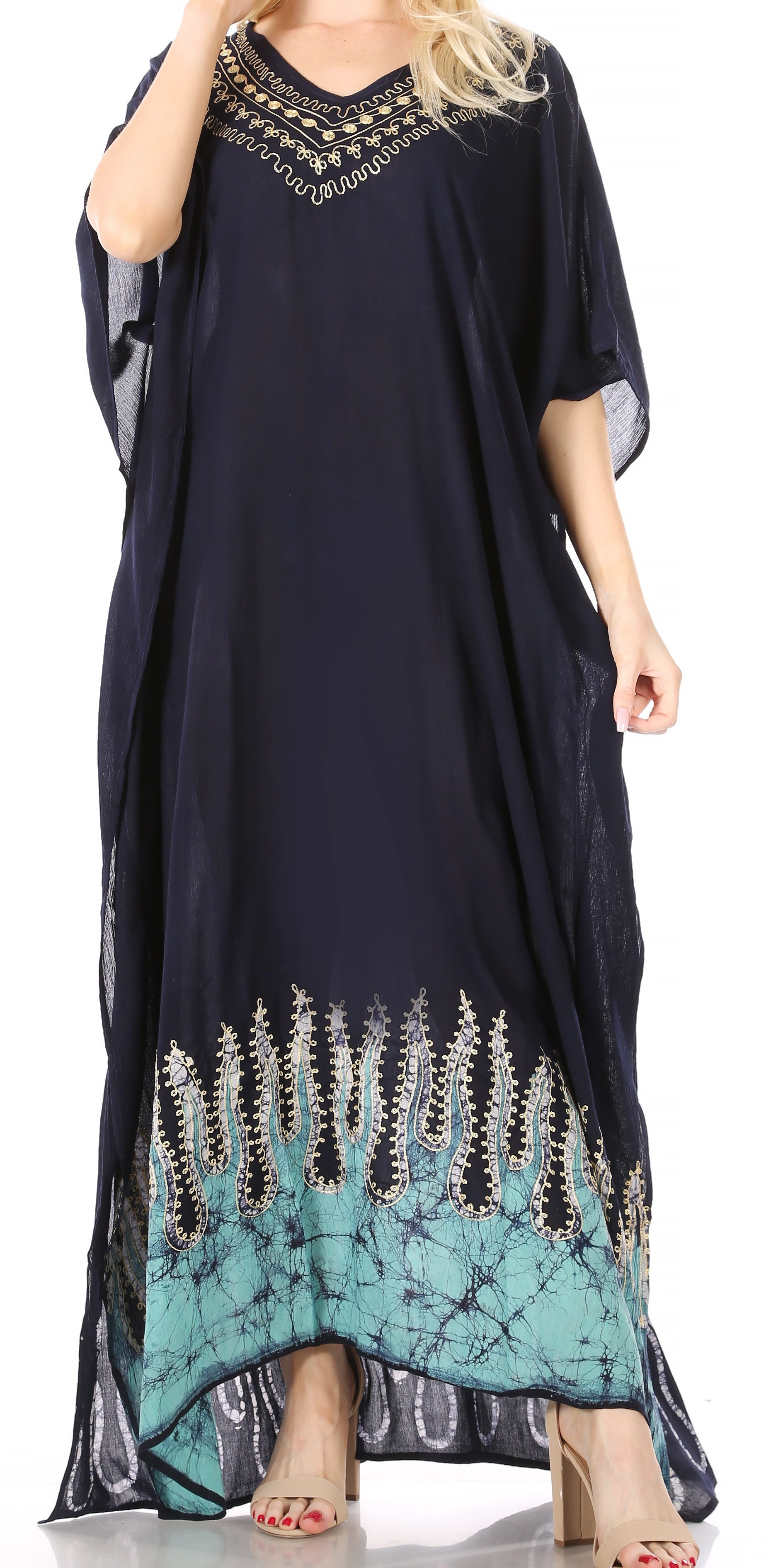 Navy blue dress with turquoise bottom section and embellishments on a white background