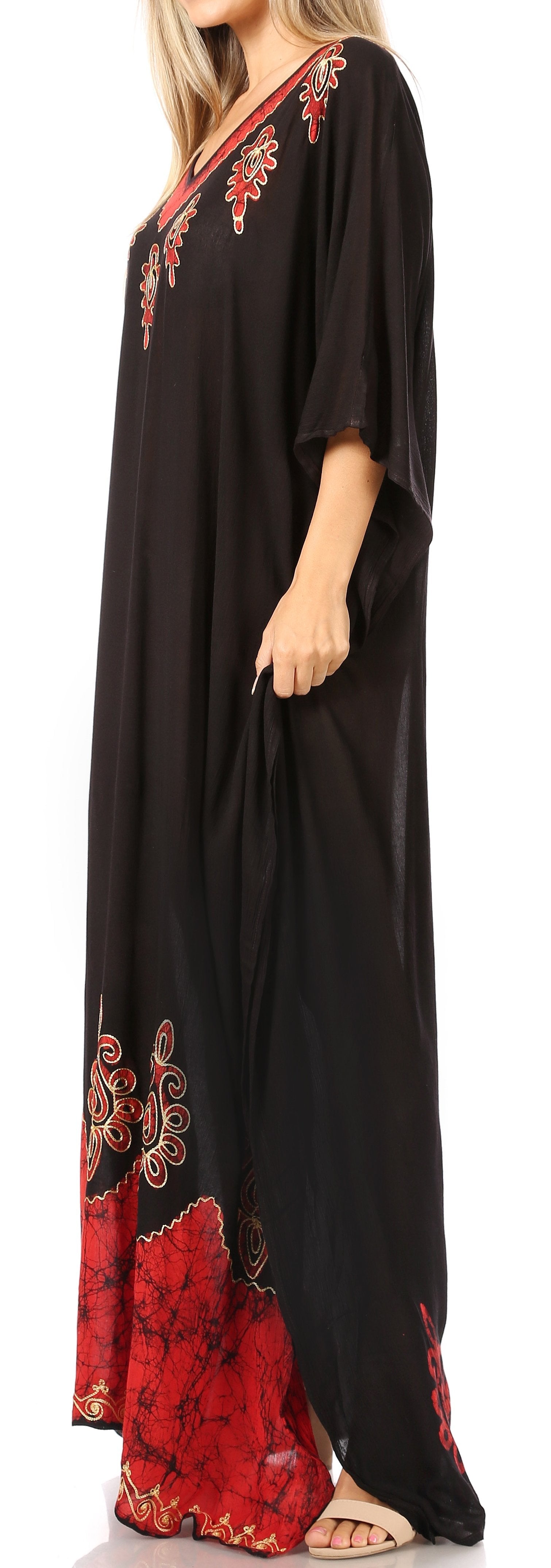 Black maxi dress with red floral embroidery on a plain background