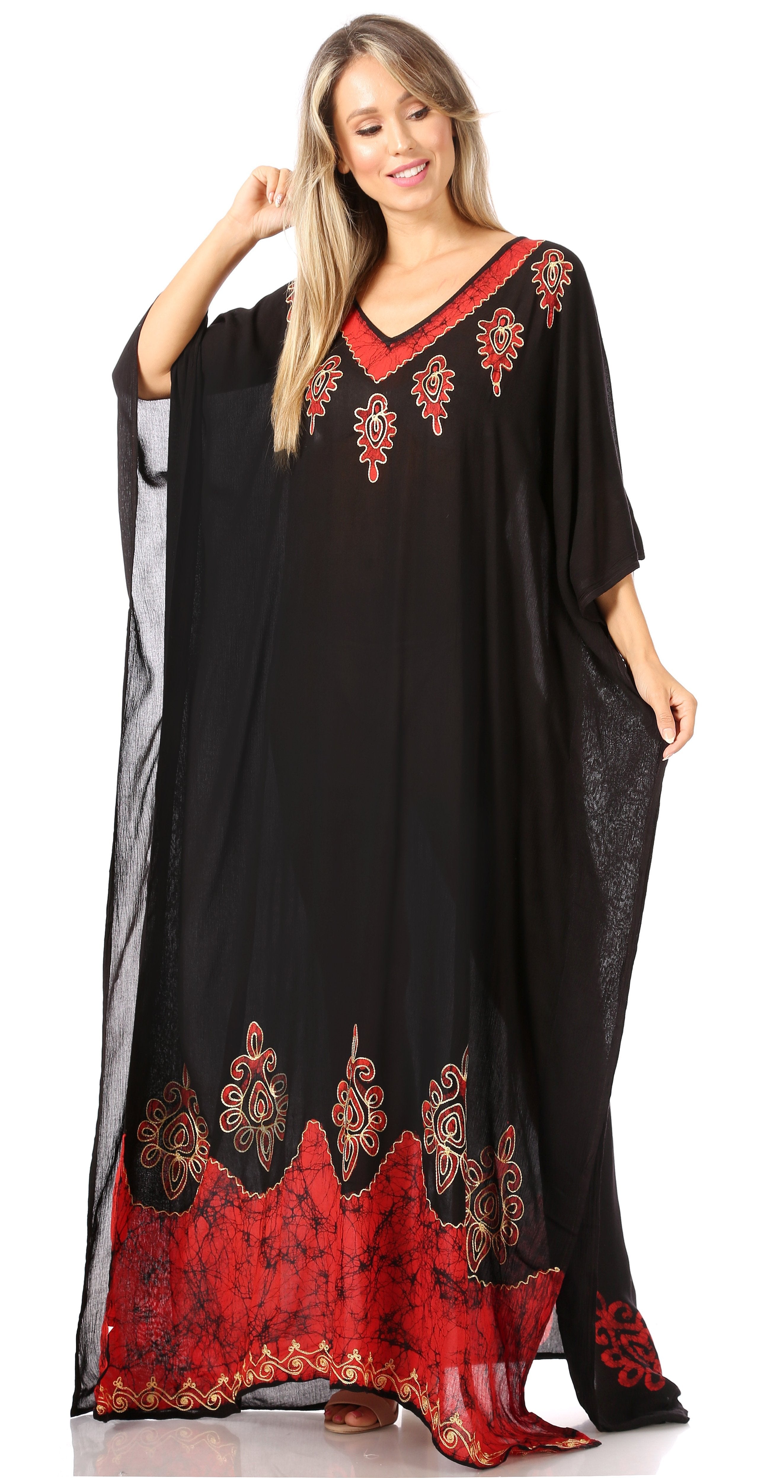Woman wearing a black and red embroidered dress on a white background