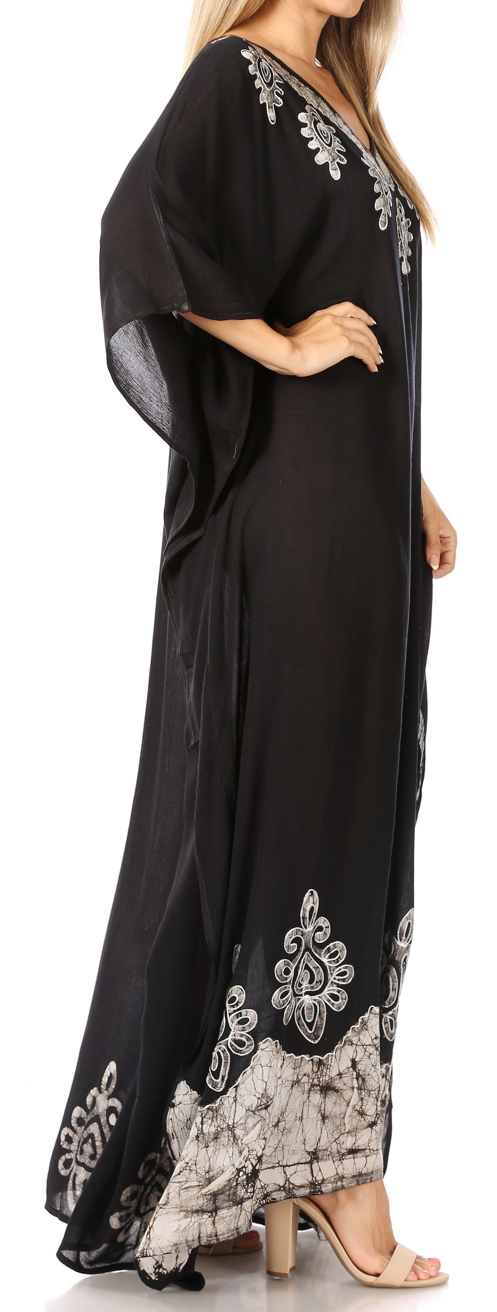 Black dress with white embroidery on a white background