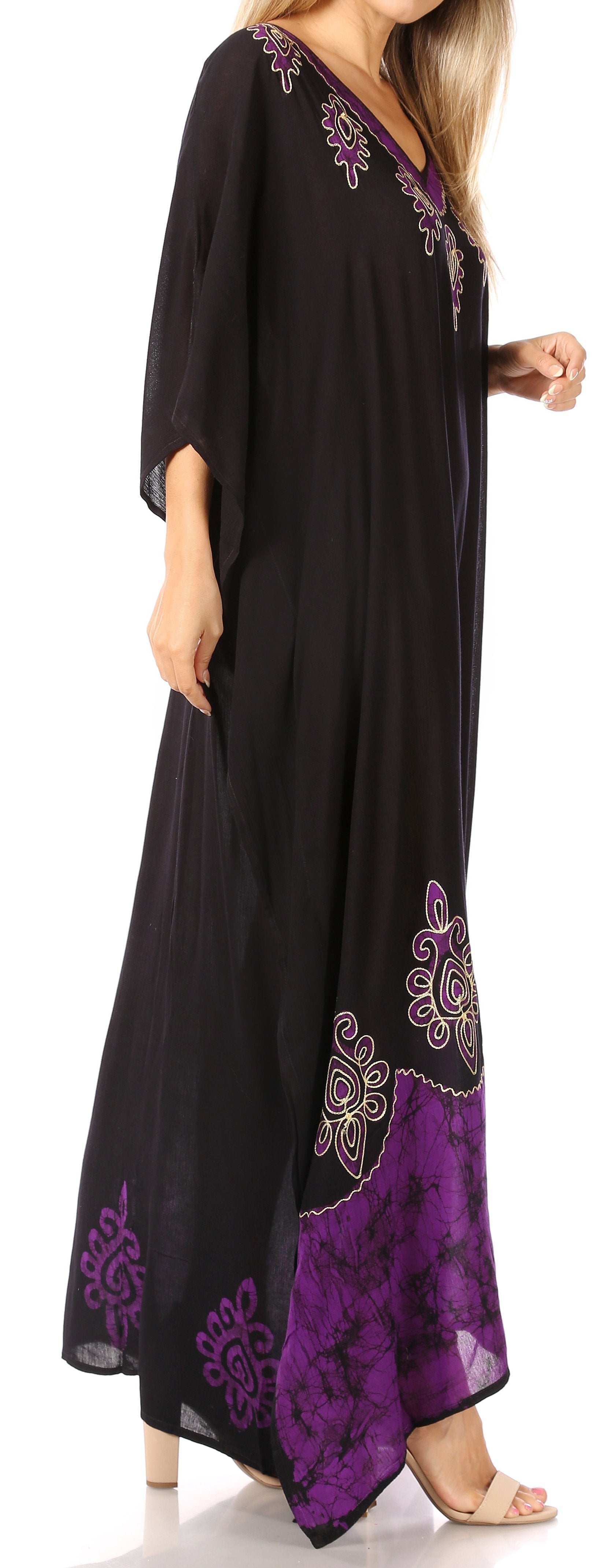 Black and purple dress with floral embroidery on a white background