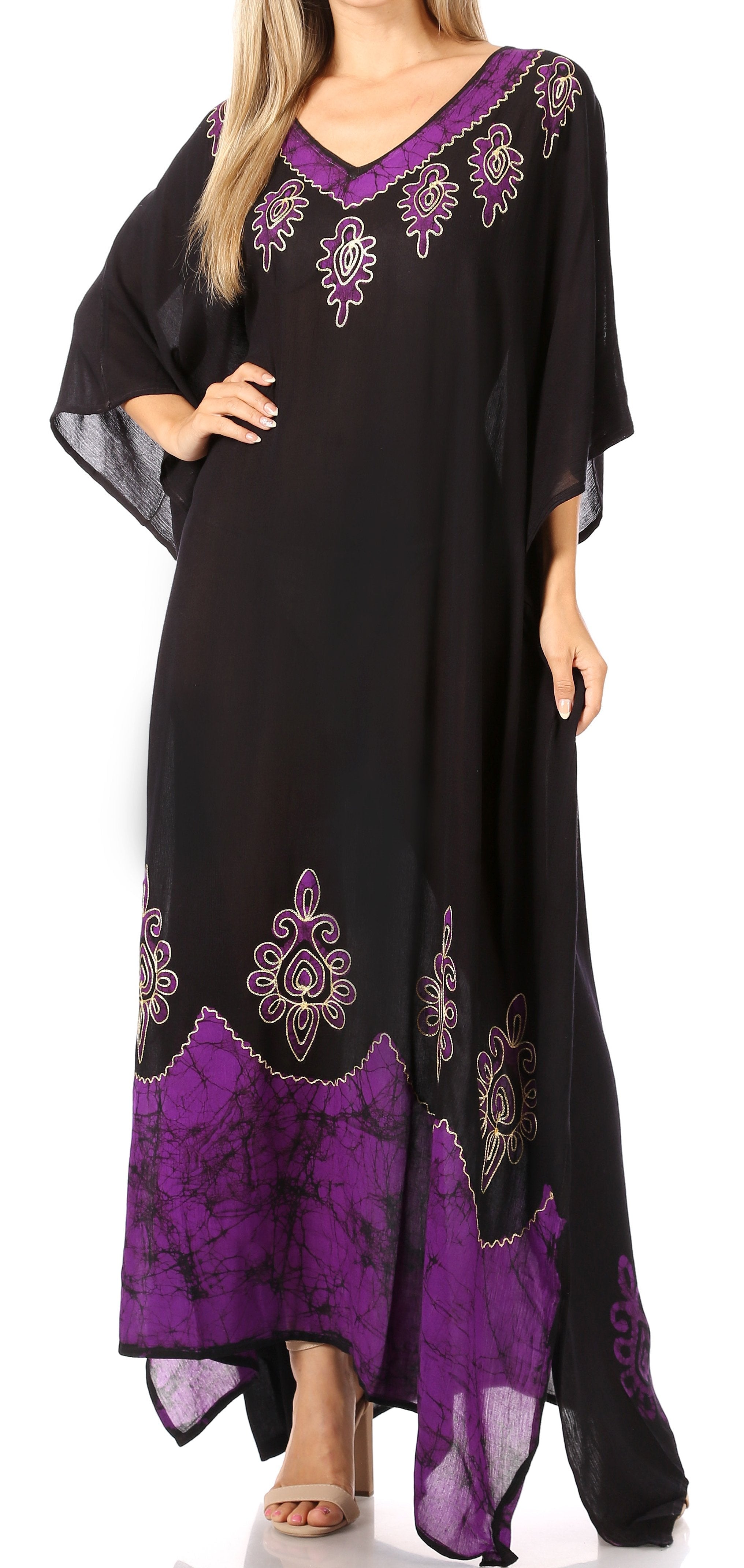 Black and purple embroidered dress on a white background