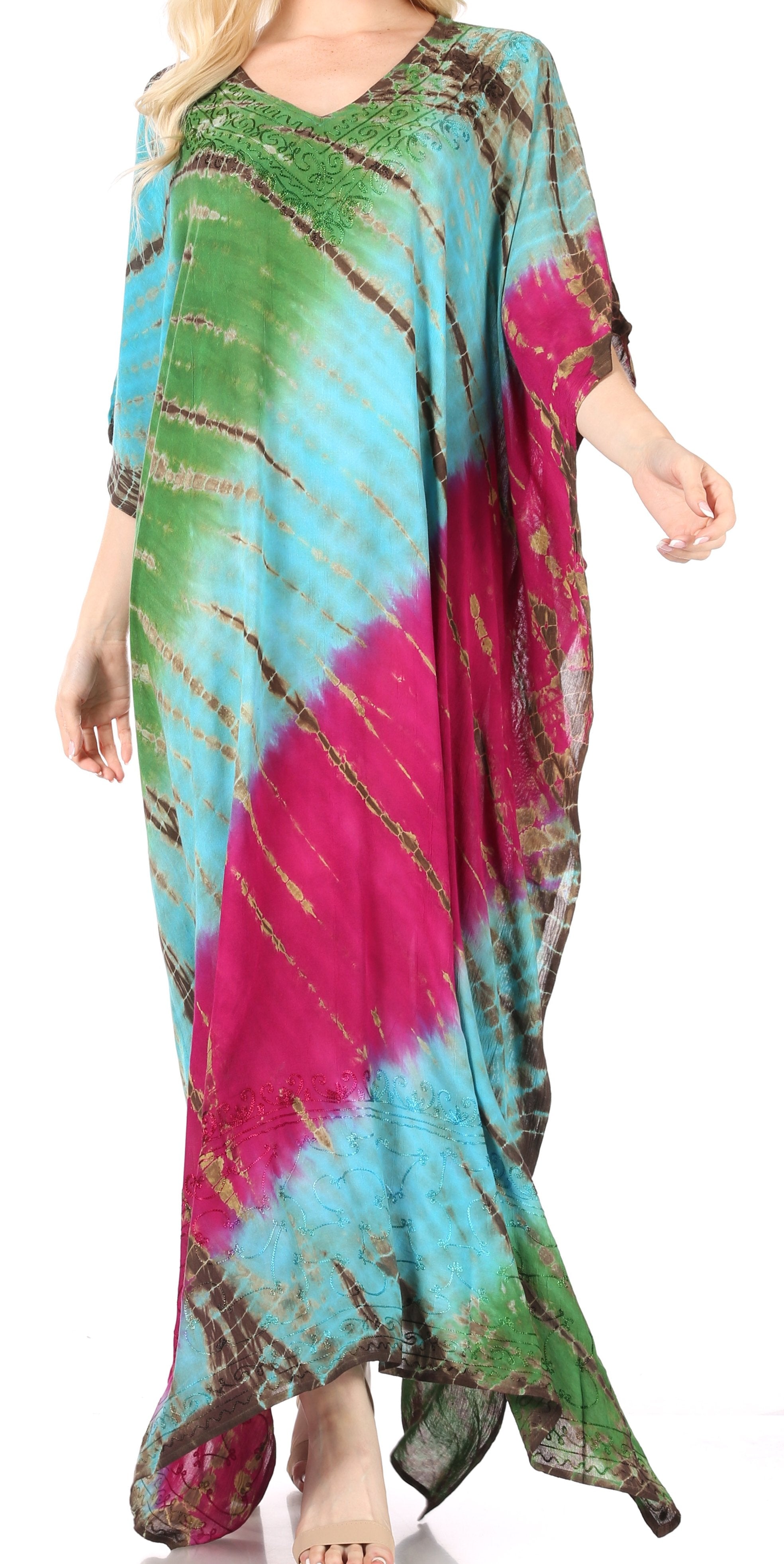 Colorful tie-dye dress worn by a model on a white background