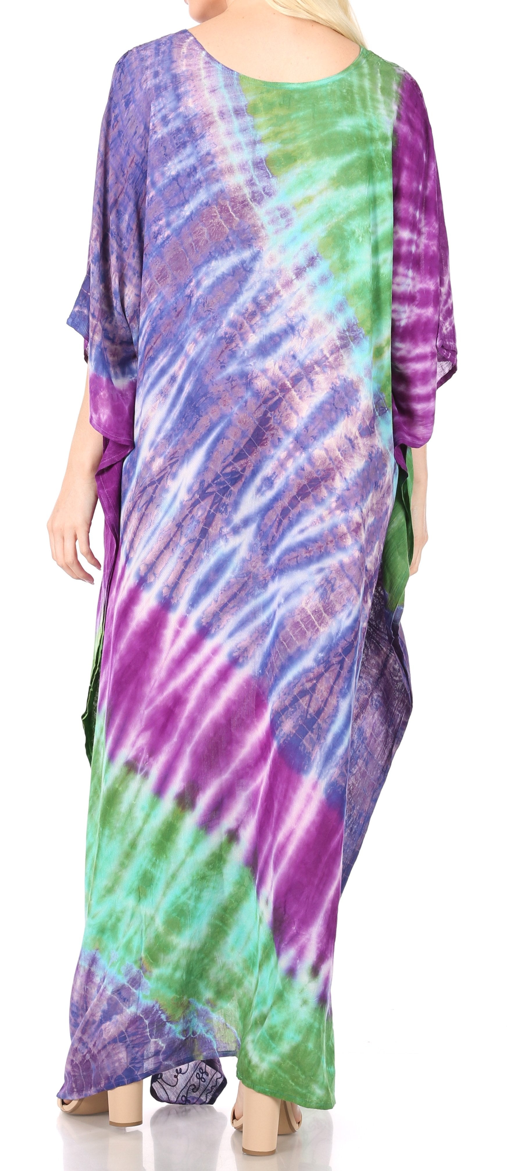 Multicolored tie-dye dress worn by a person on a white background