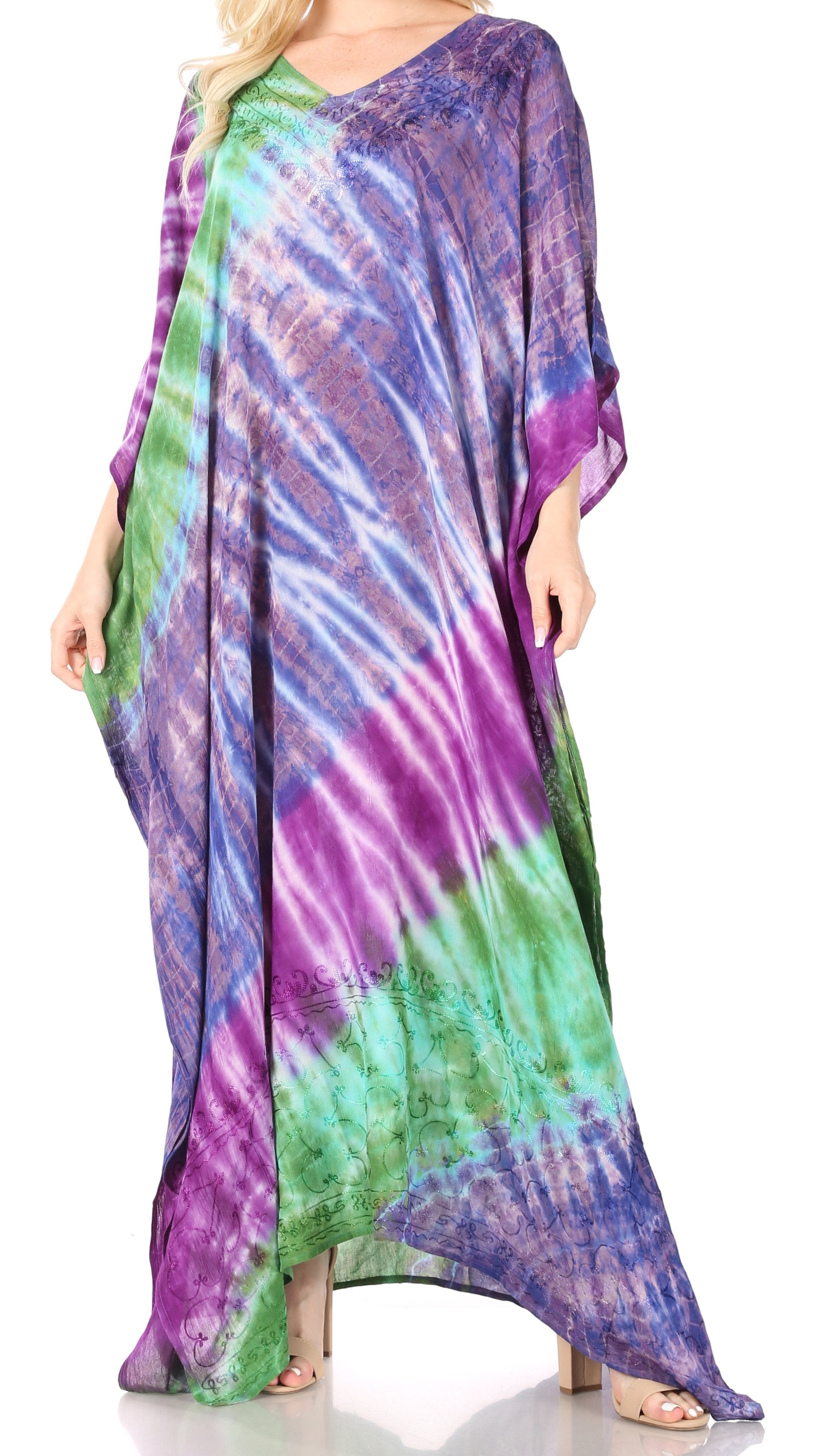 Colorful tie-dye dress worn by a person on a white background