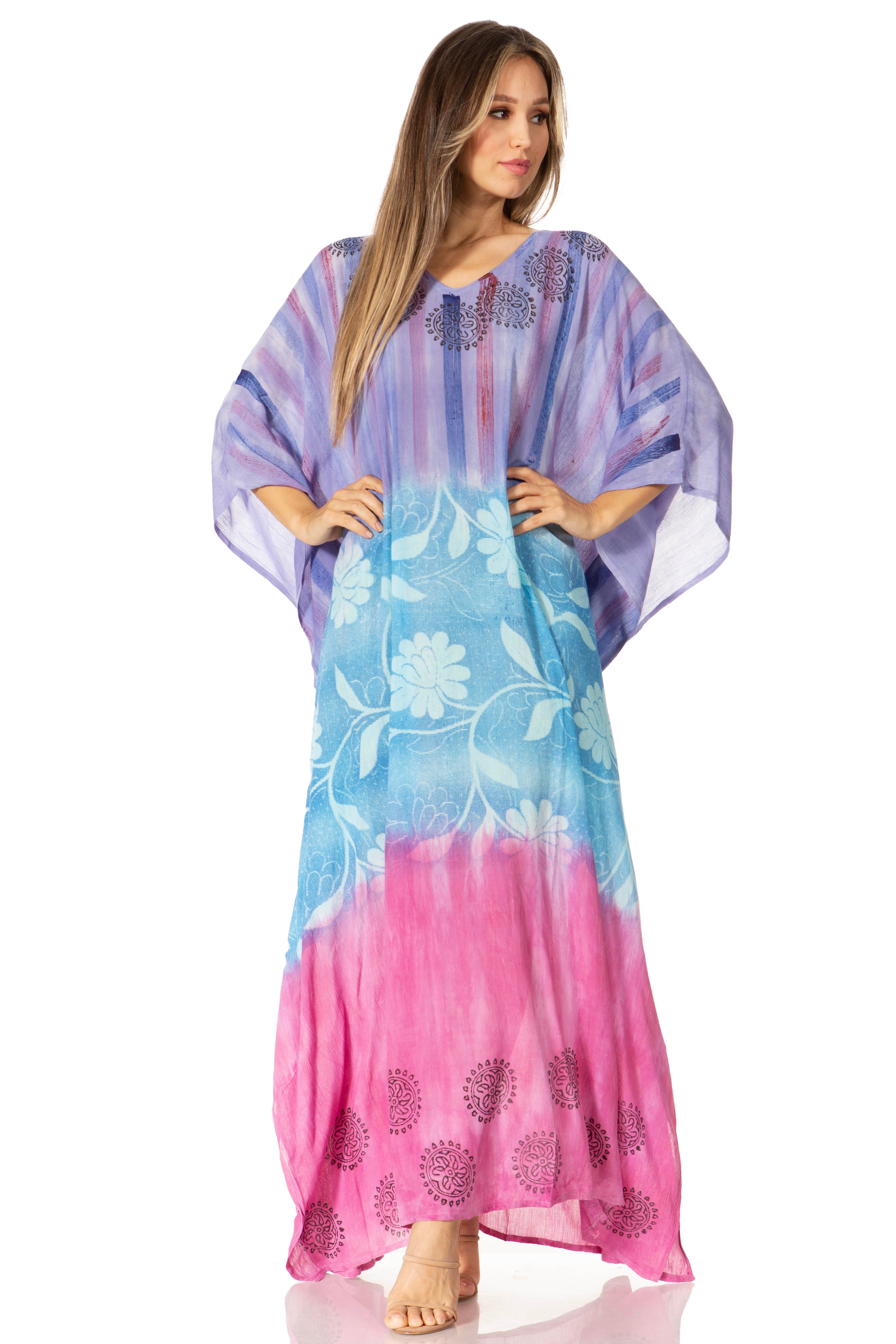 Woman wearing a colorful dress with a gradient from blue to pink on a white background
