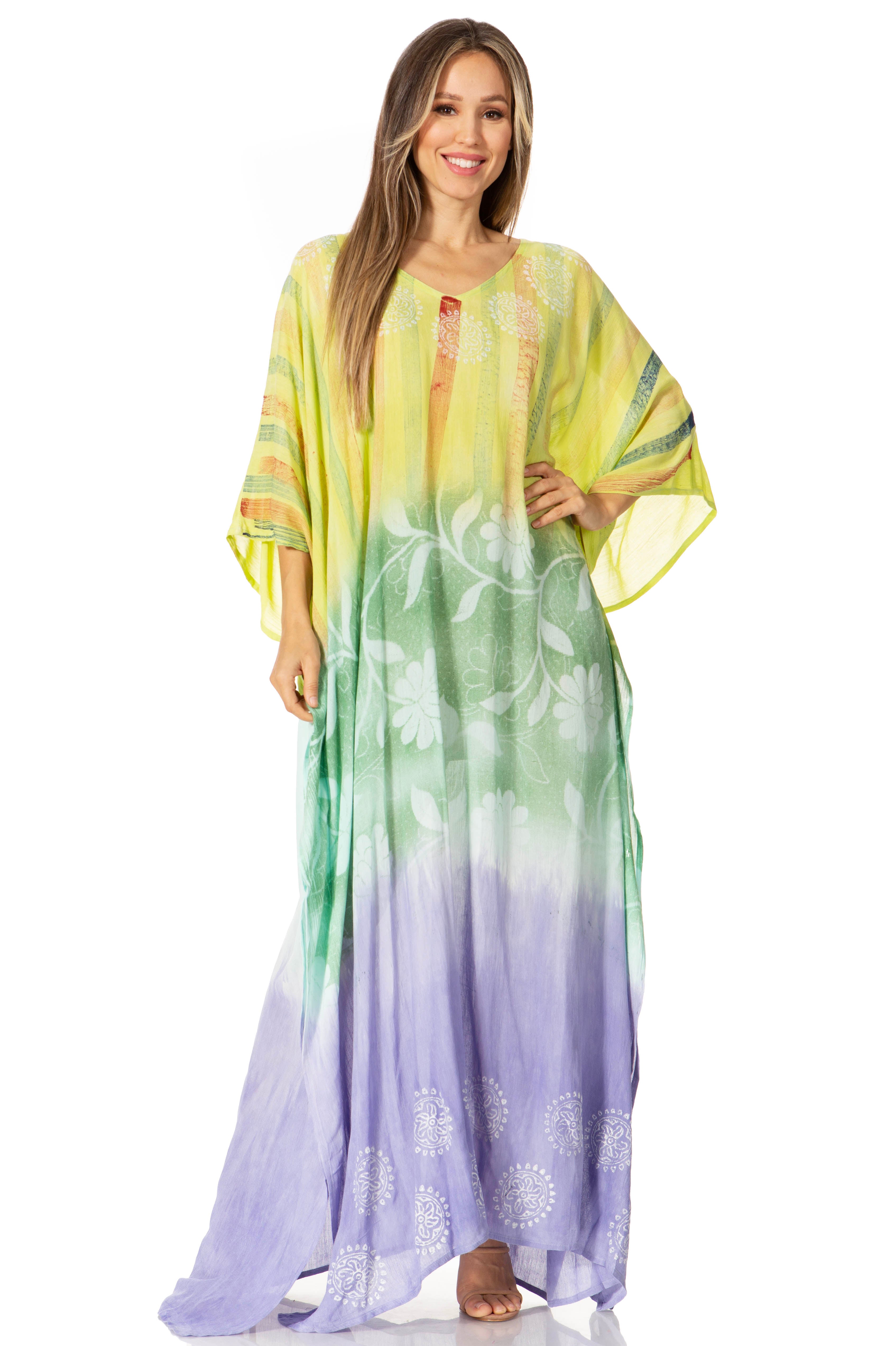 Woman wearing a colorful gradient dress with floral patterns on a white background