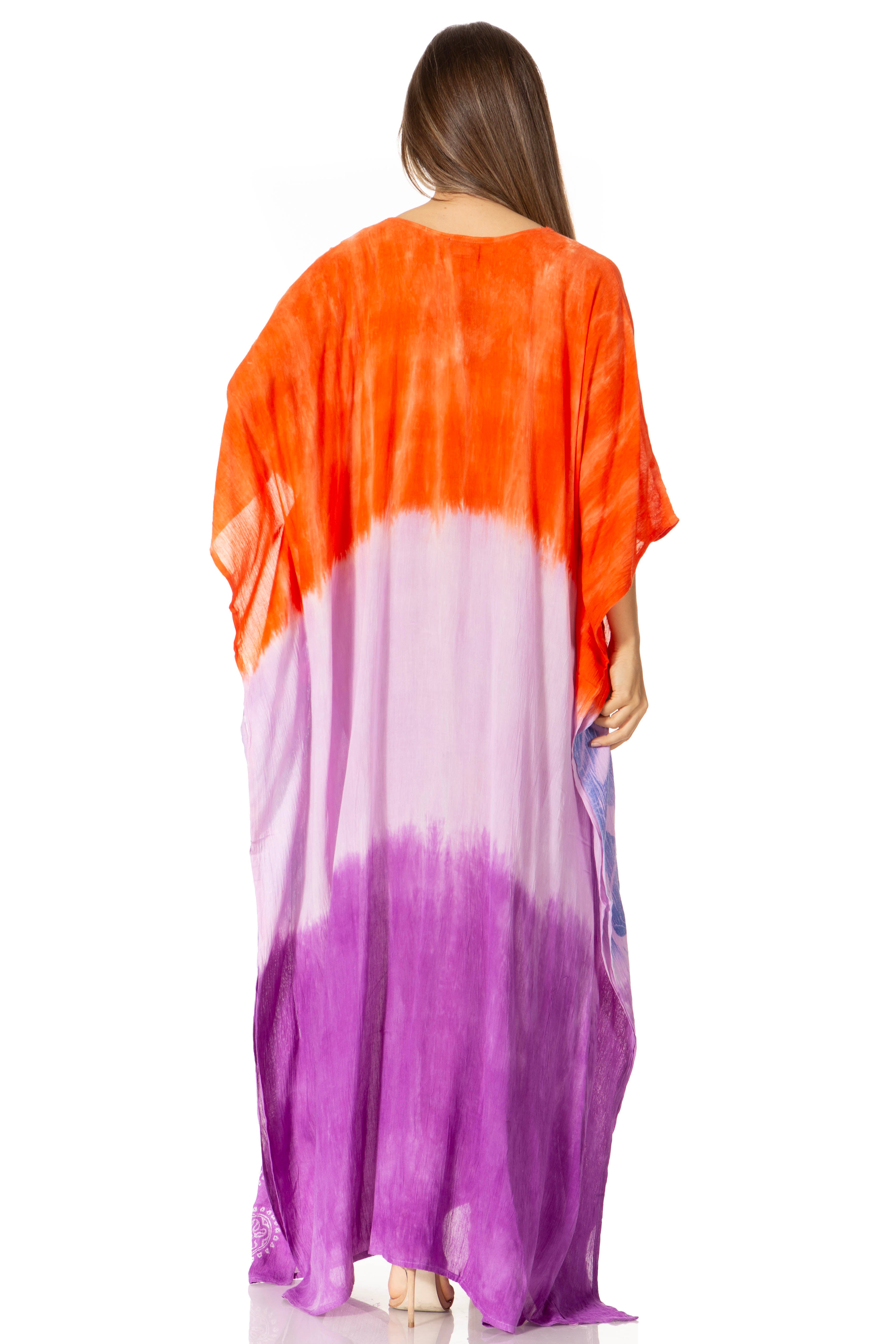Woman wearing a colorful tie-dye dress with orange, white, and purple gradient on a white background.