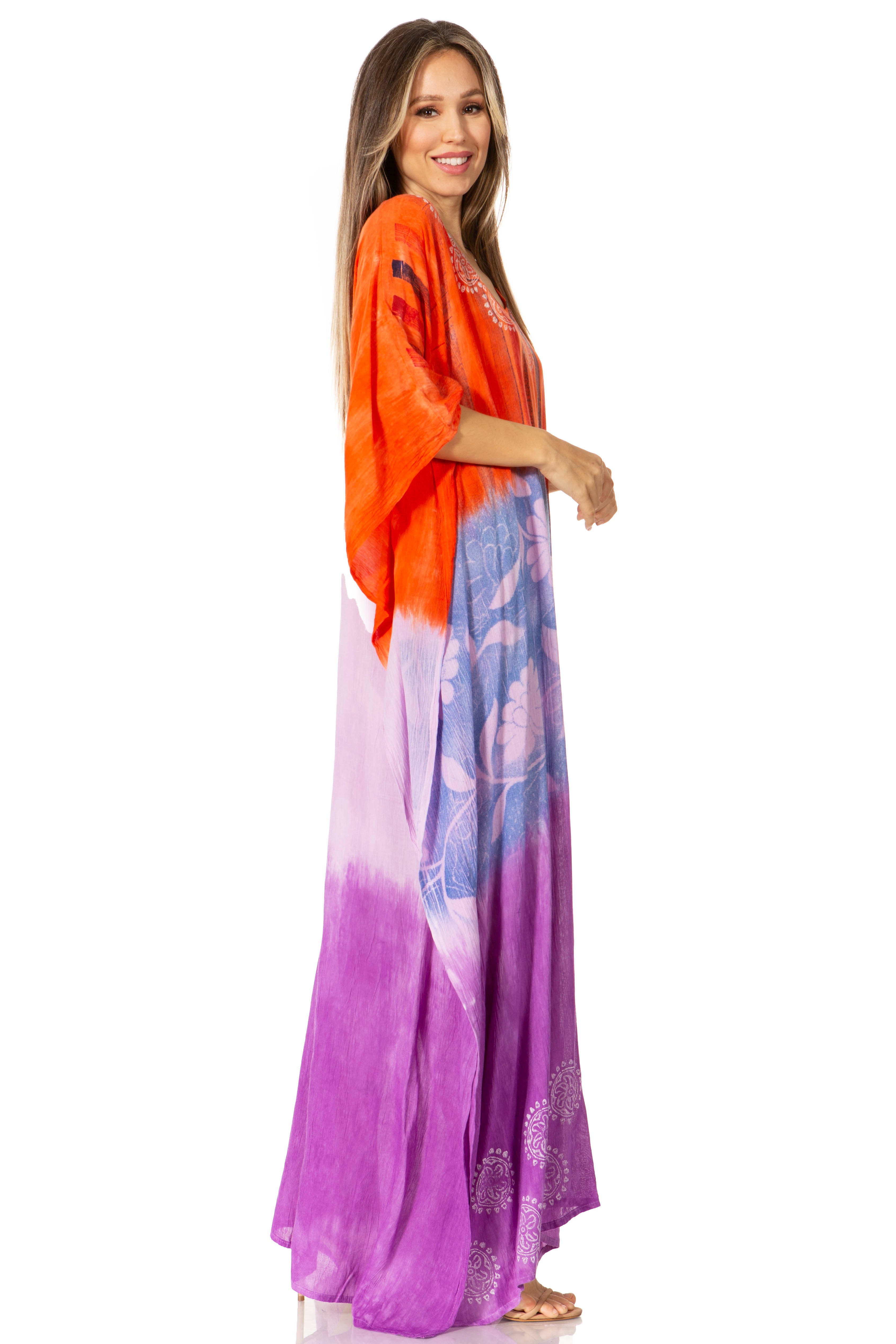 Woman wearing an orange and purple dress with a floral pattern on a white background