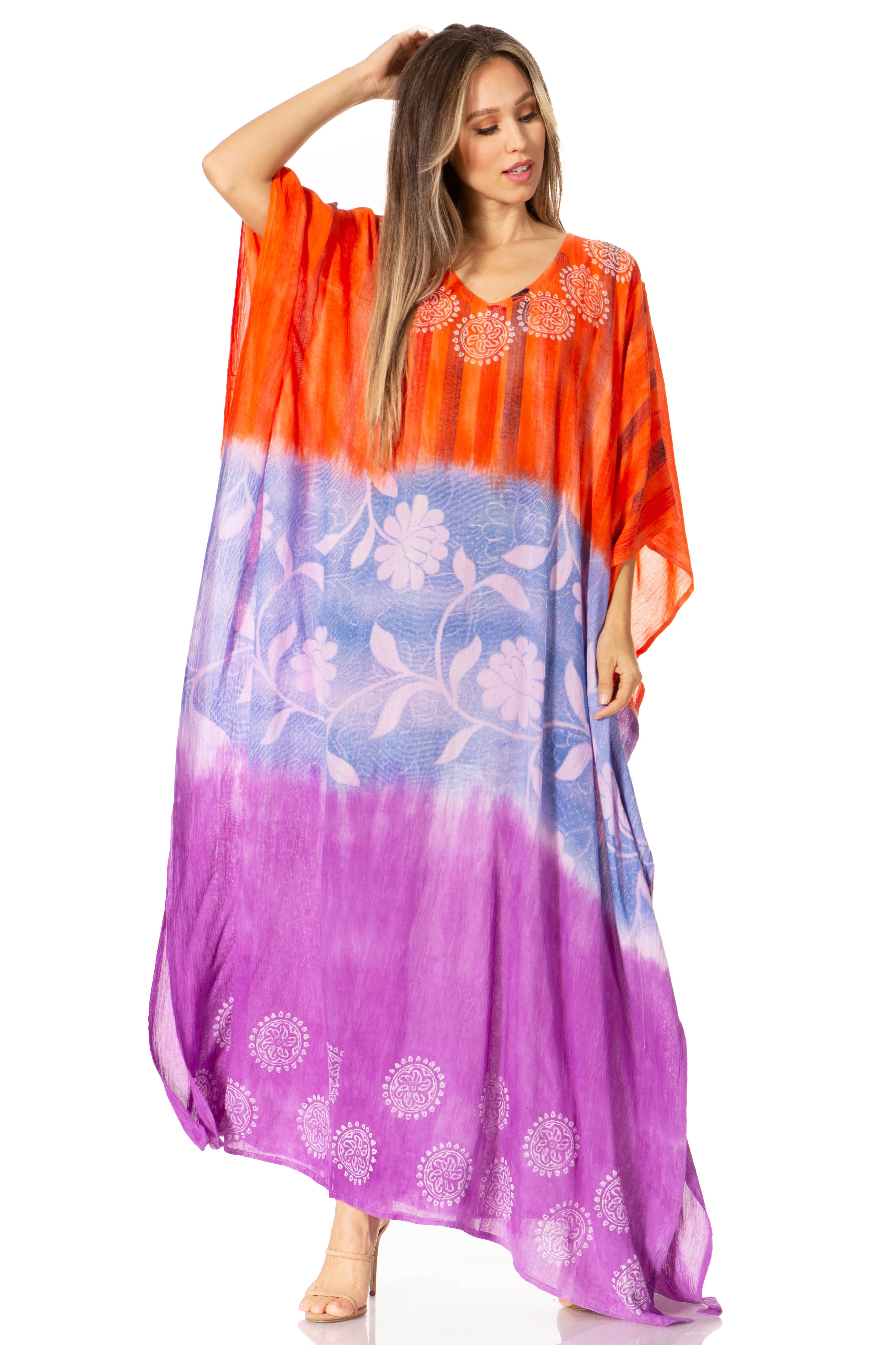Woman wearing a colorful dress with an orange, blue, and purple gradient.