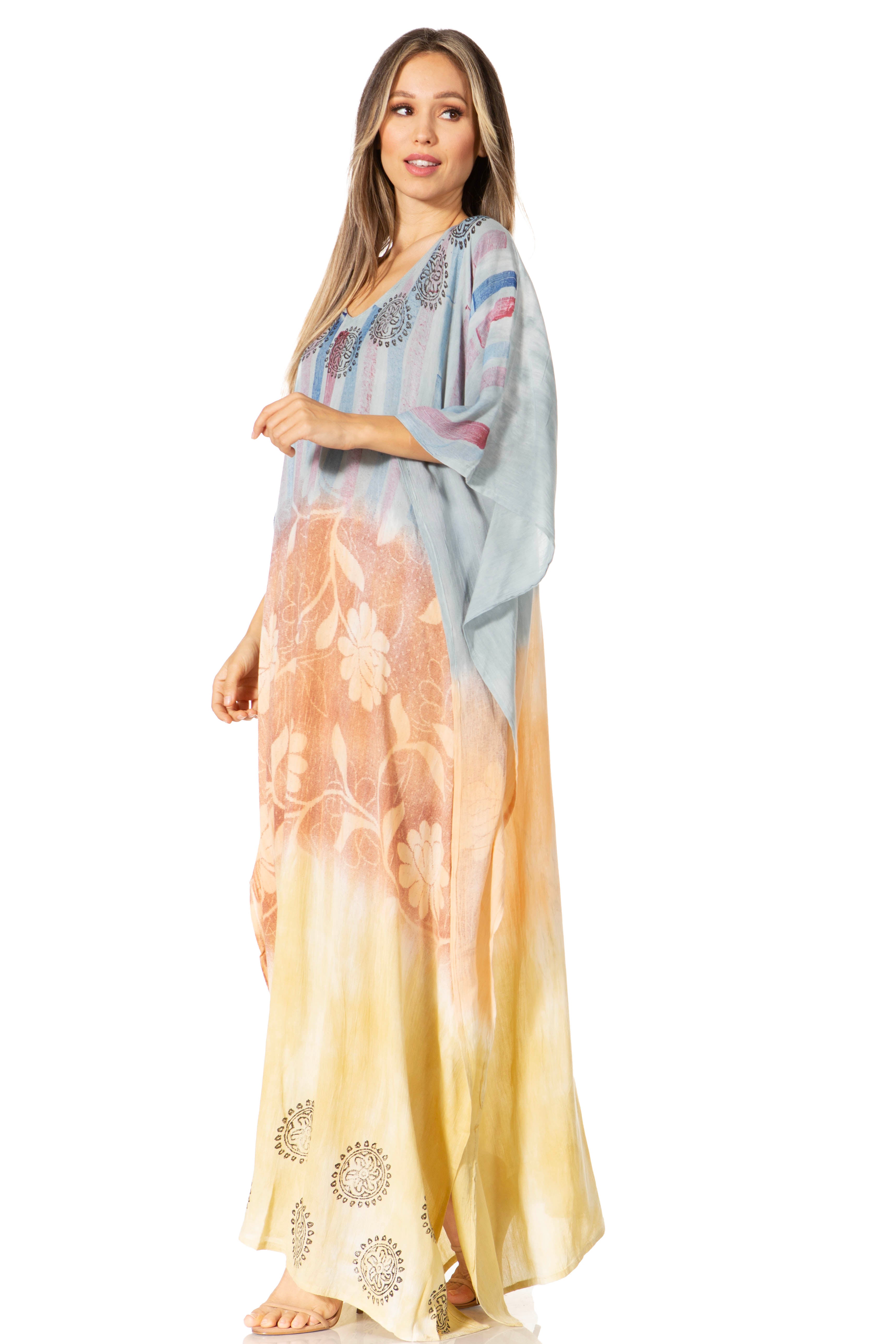 Woman wearing a long, colorful dress with a gradient pattern on a white background