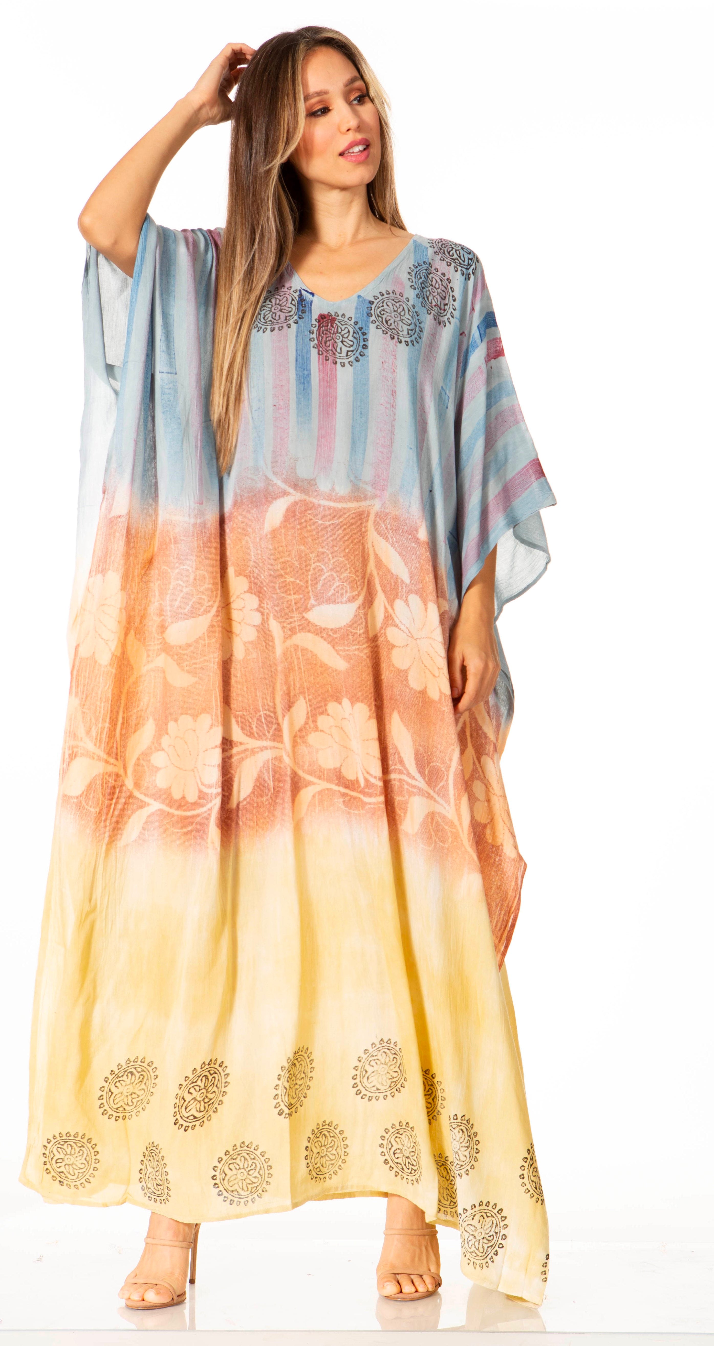Woman wearing a colorful dress with a gradient pattern on a white background
